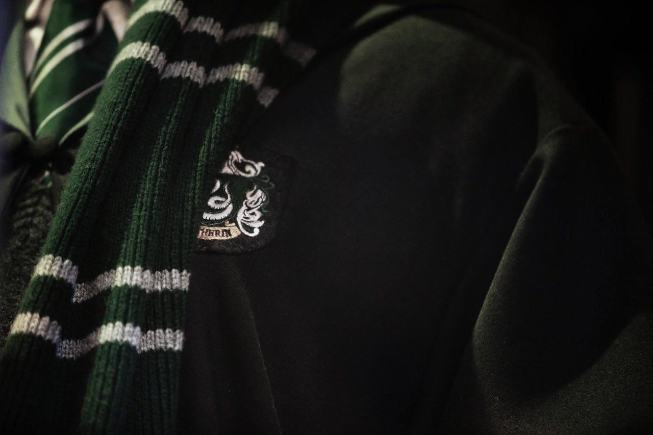 A close up of the scarf and sweater - Slytherin