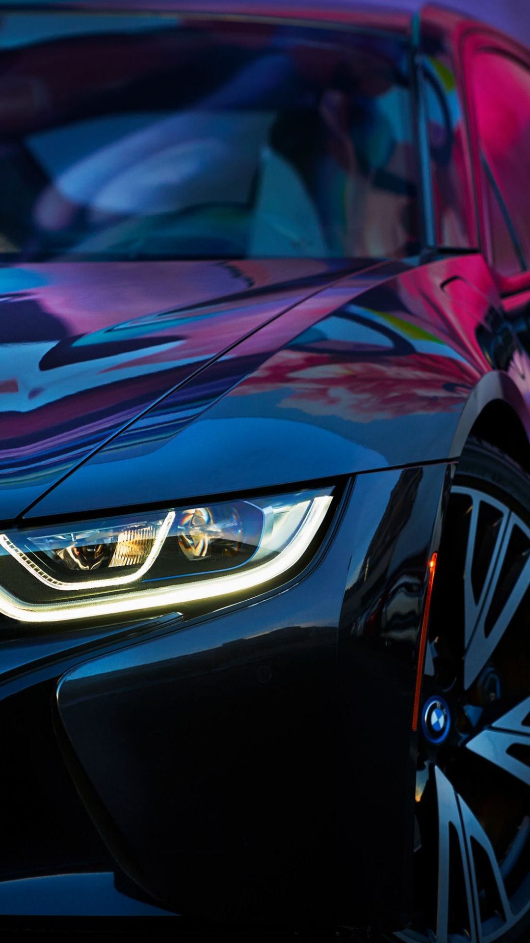 A close up of the front of a black BMW i8 - Cars