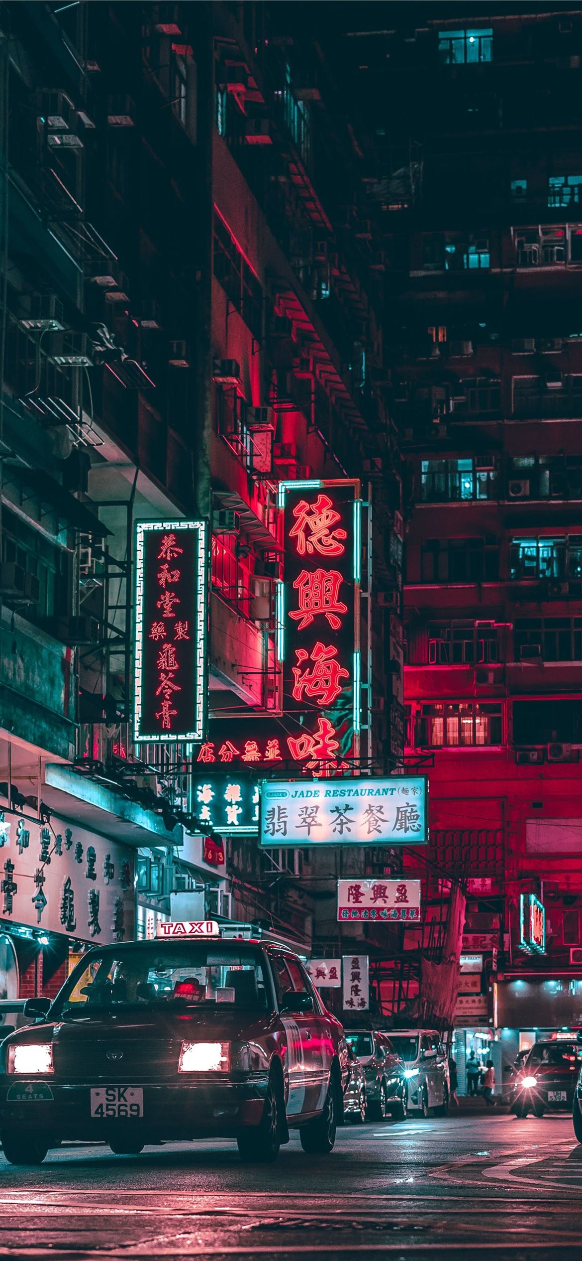 A city street with cars and buildings - Cars