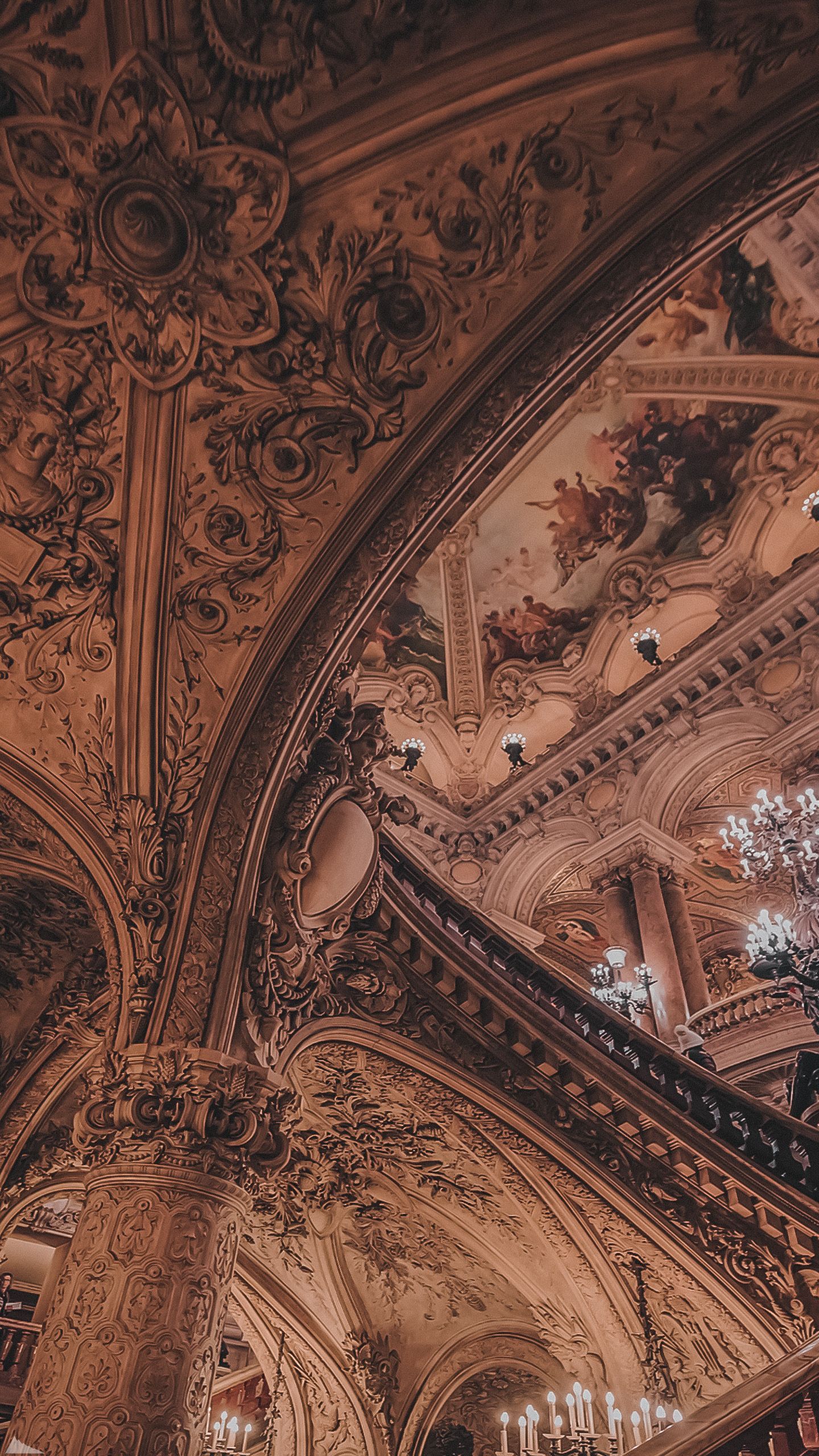 A staircase with ornate decorations and chandeliers - Architecture