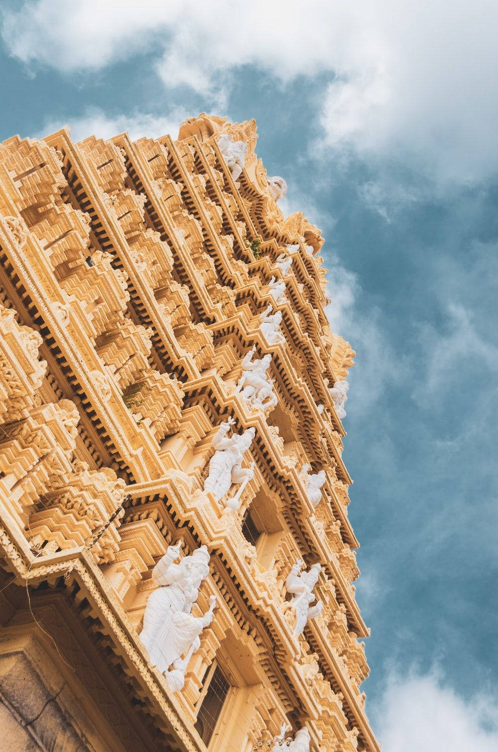 A tall building with many windows and decorations - Architecture