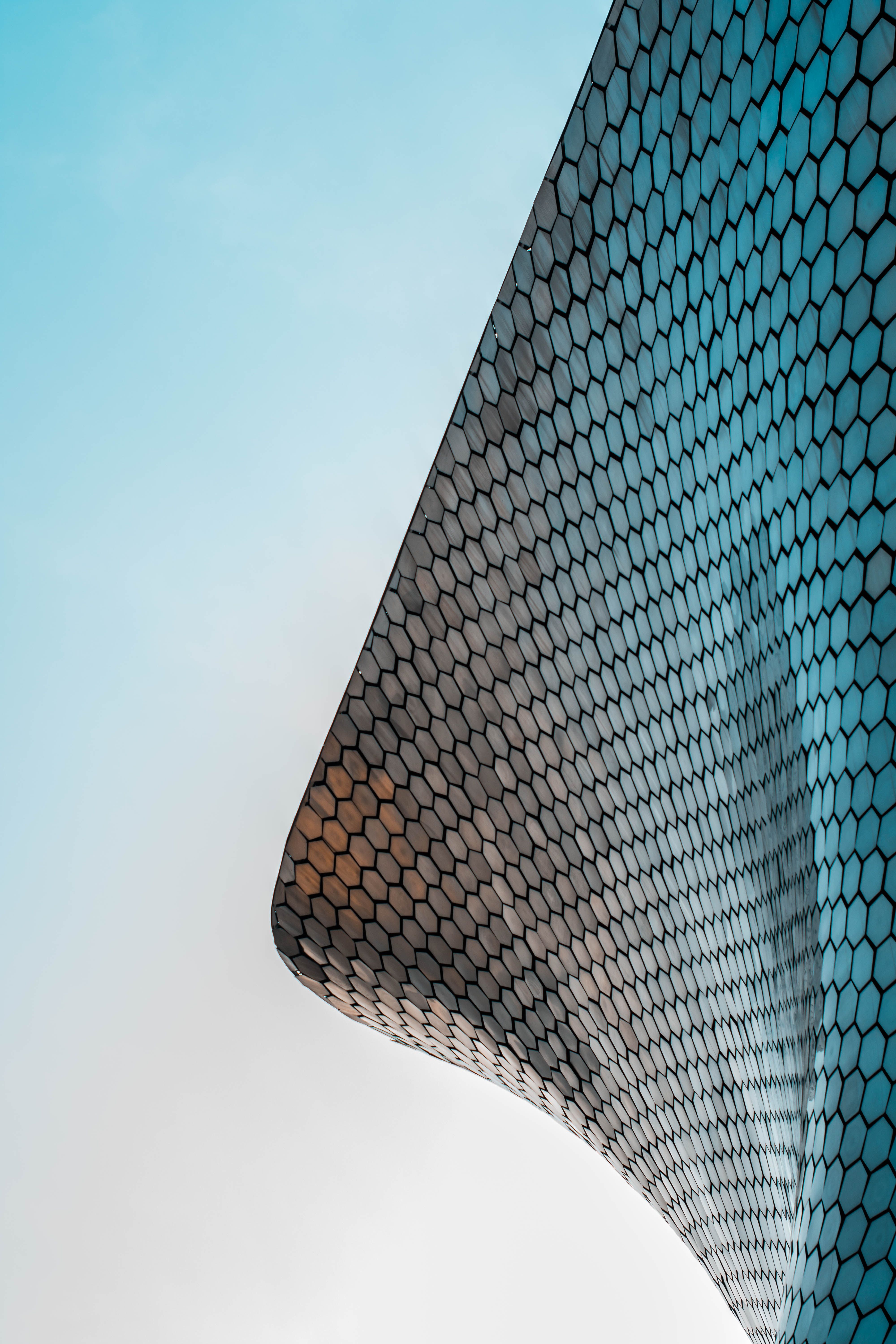 A building with a honeycomb pattern on its facade. - Architecture