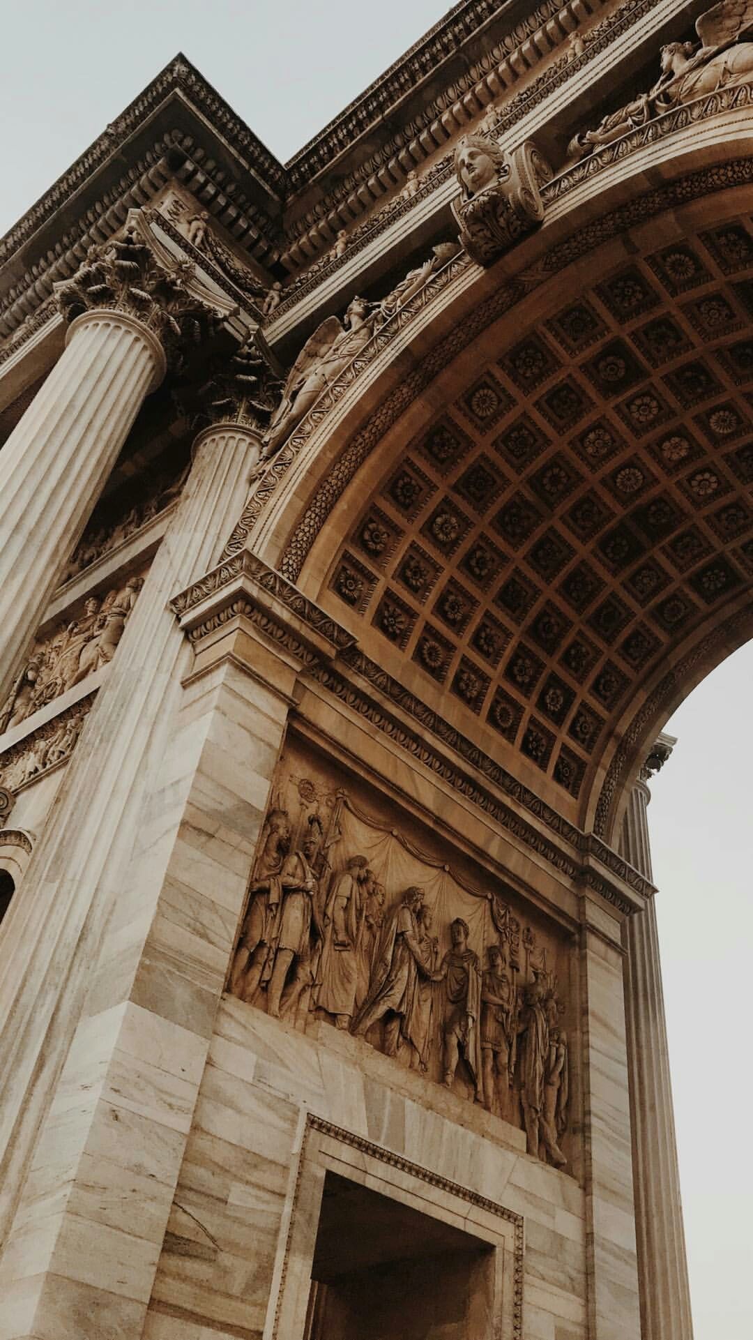 The Arc de Triomphe is a famous arch in Paris, France. - Architecture