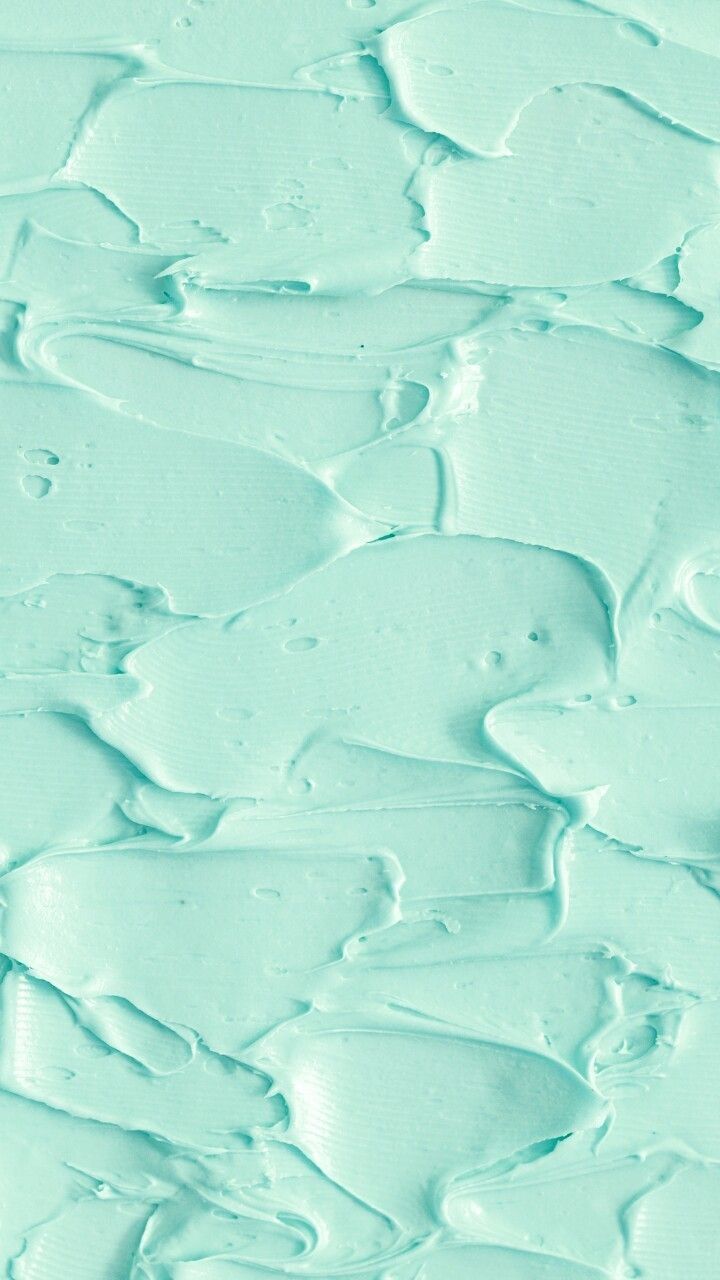 Close up of a turquoise colored cream texture - Mint green