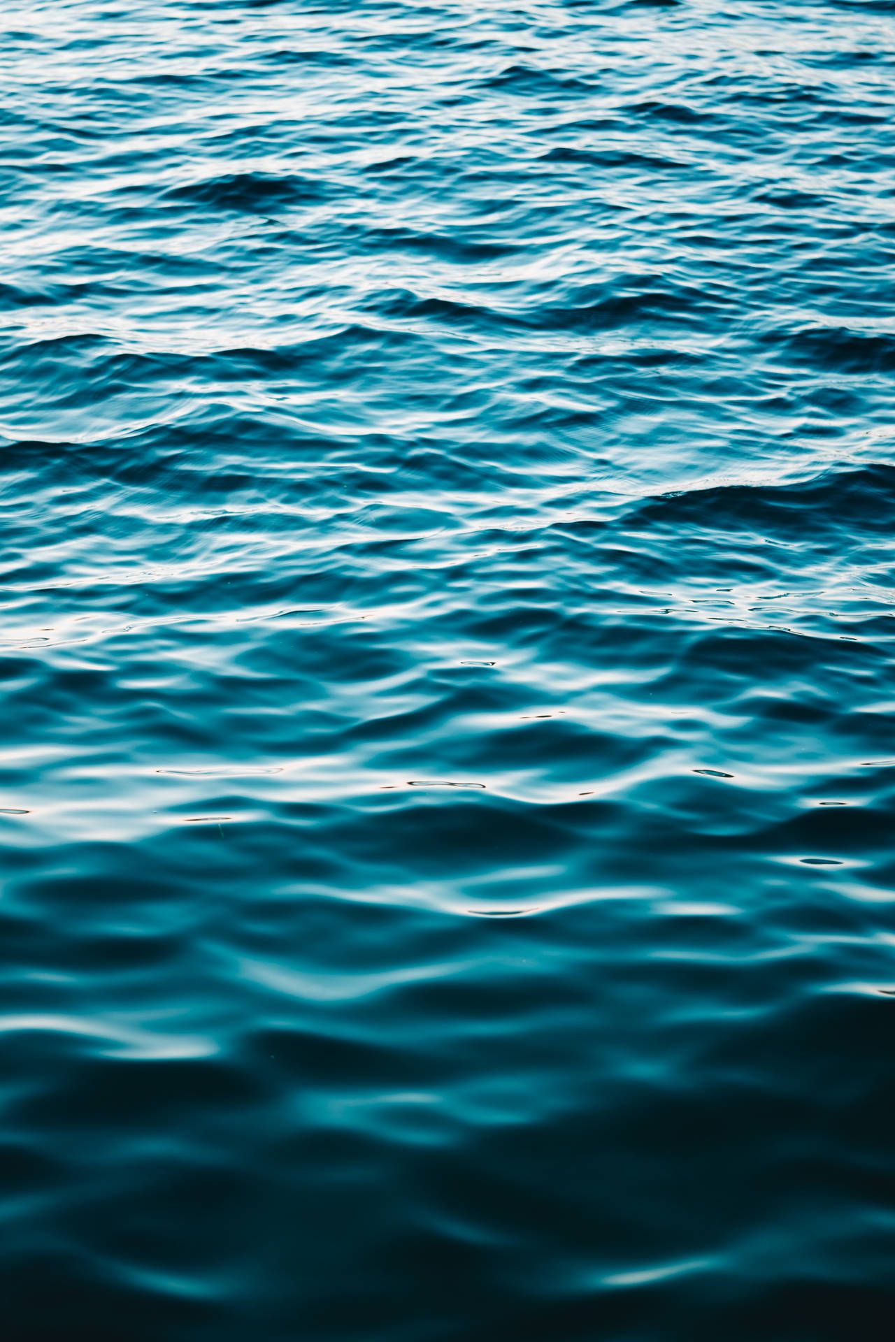 A close up of the ocean water with small ripples - Ocean