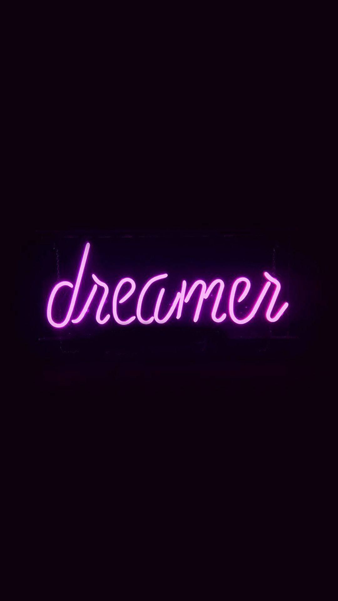 Neon sign that says dreamer in purple - Neon