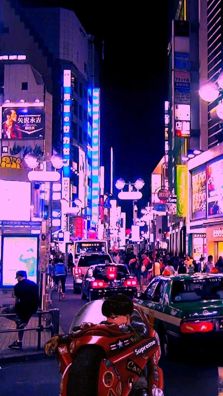 A city street with many cars and people - Tokyo