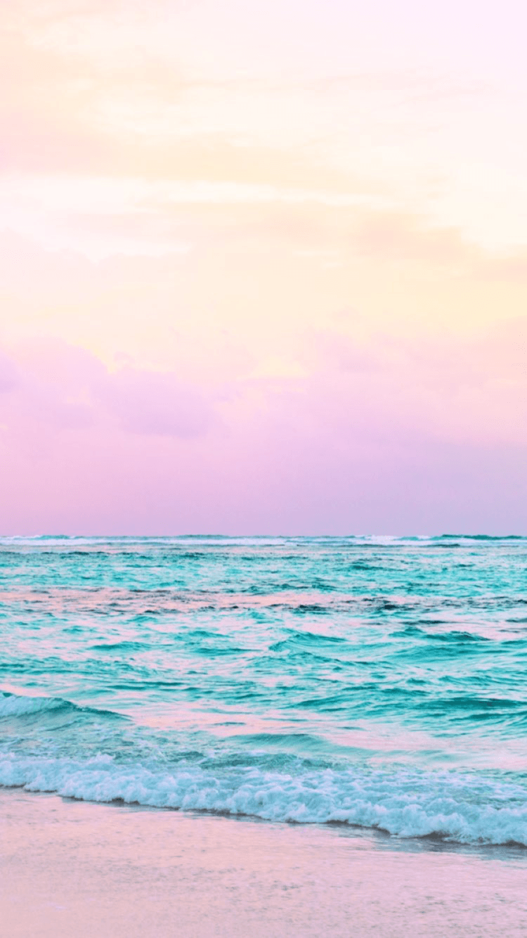 A serene image of the ocean with a pink and blue sunset. - Ocean
