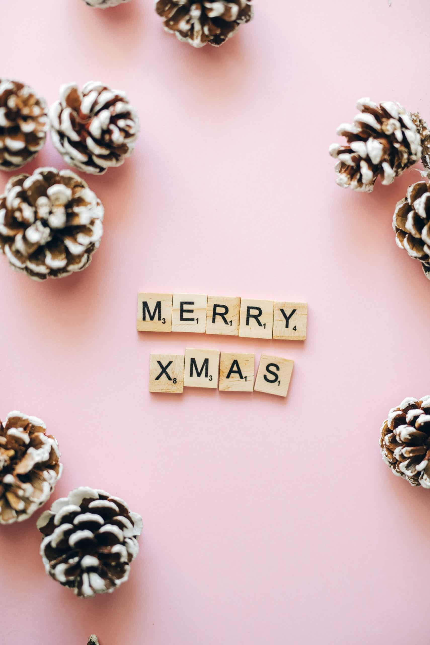 A pink background with christmas words and cones - Christmas iPhone, Christmas, candy cane, cute Christmas, cute iPhone, pretty, white Christmas, nails