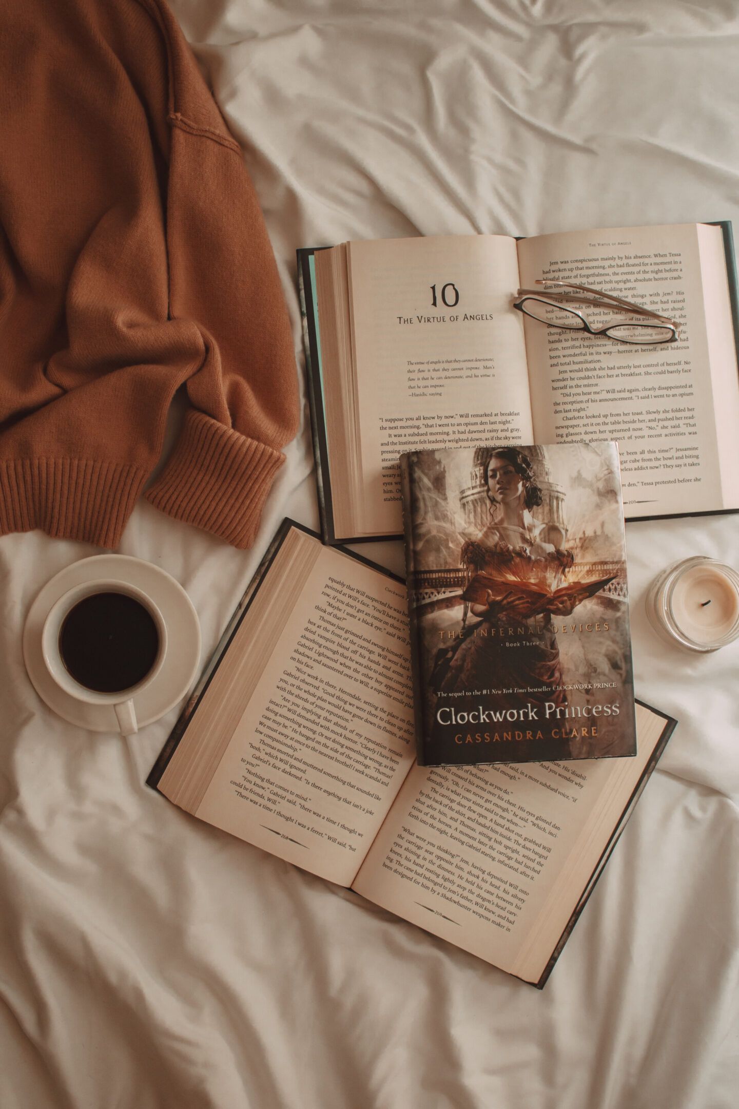 A book is laying on top of the bed - Books