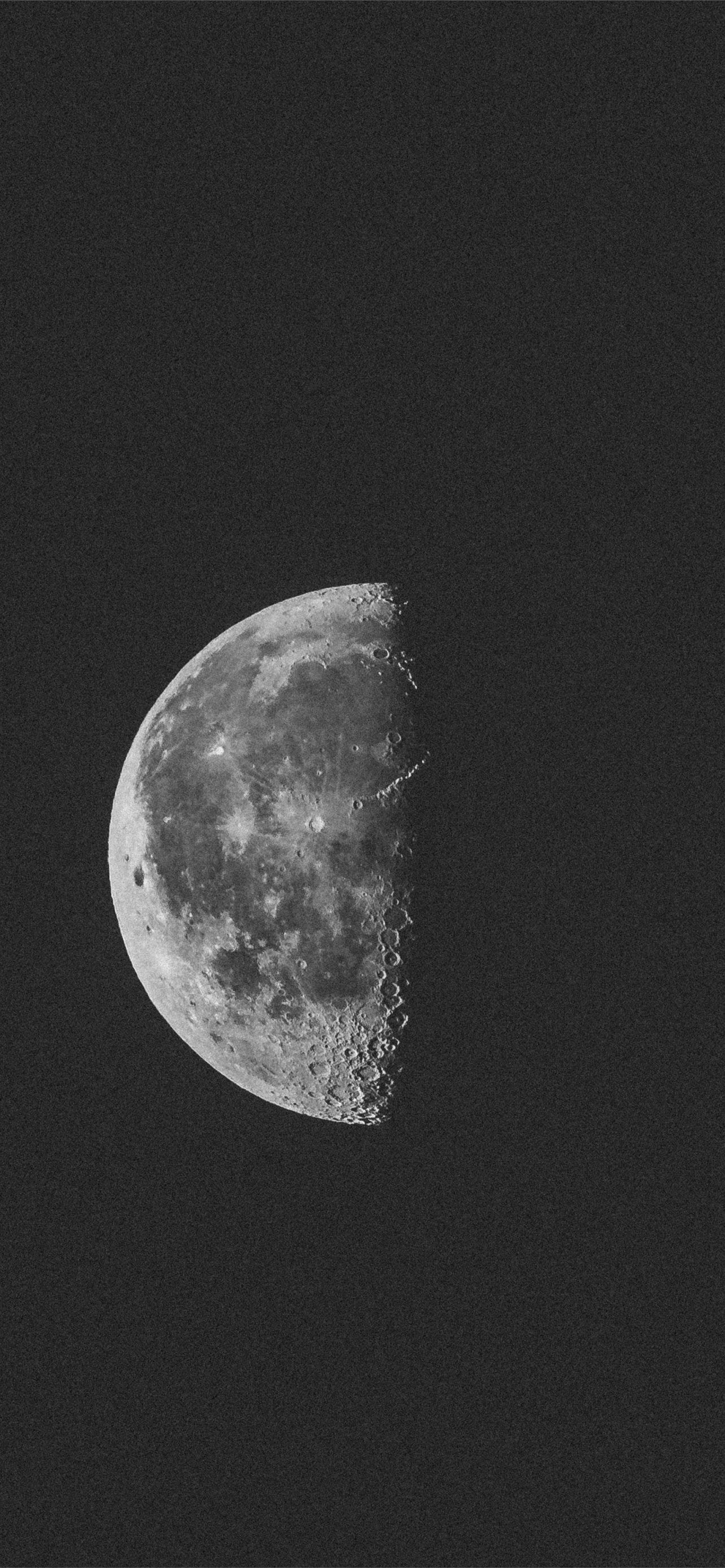 A black and white photo of the moon - Moon