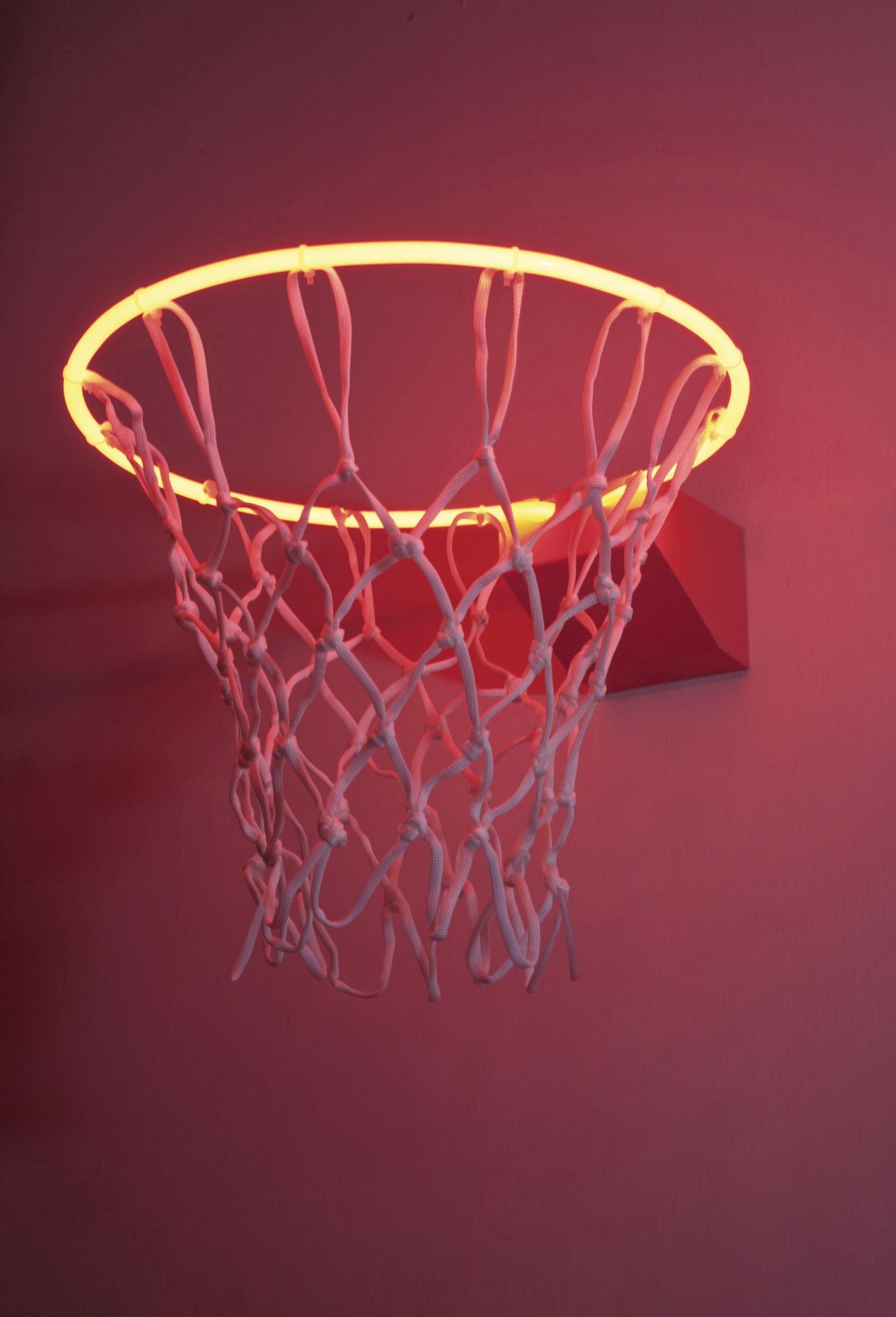 A basketball hoop with a neon orange rim - Basketball