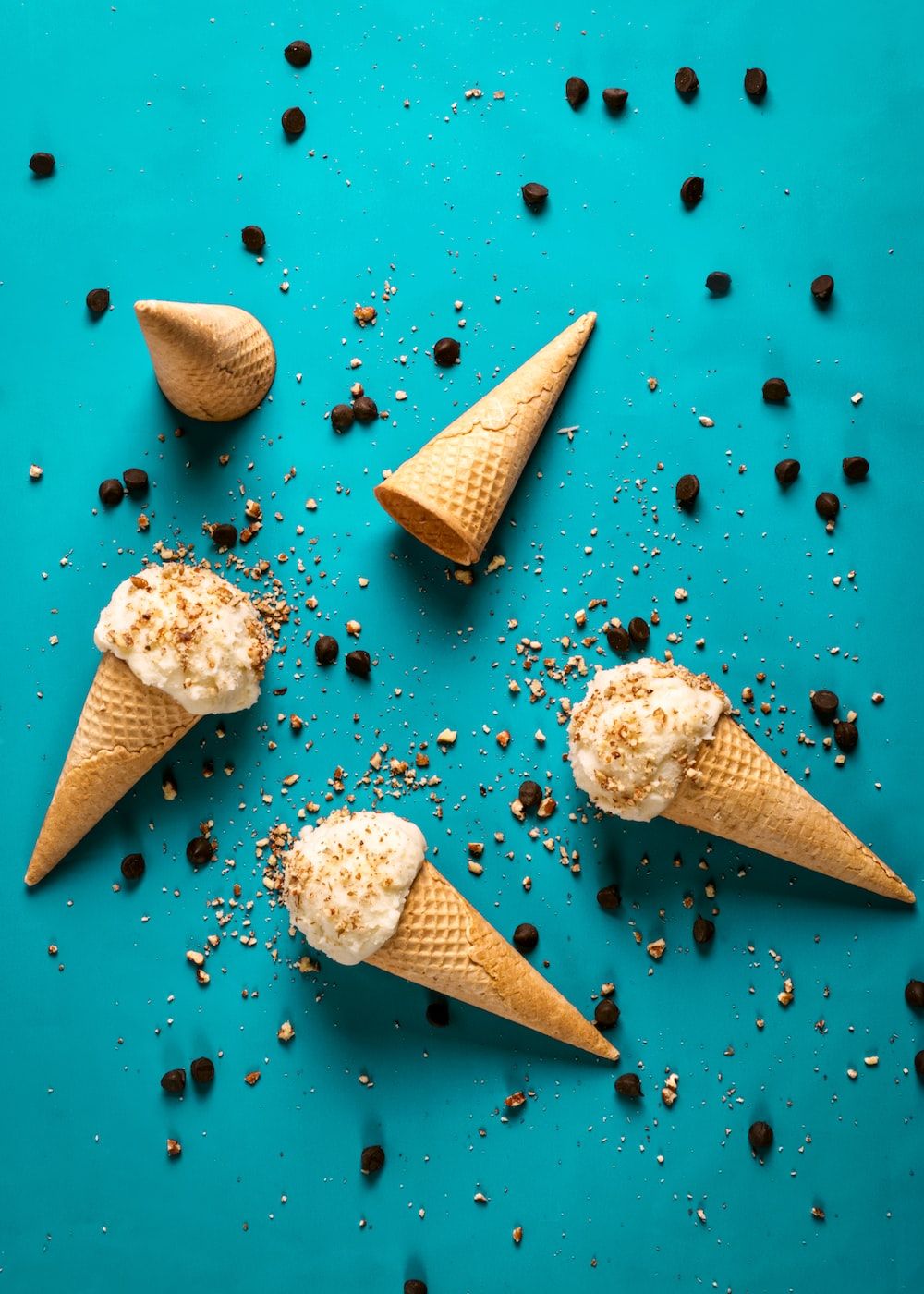 A group of ice cream cones with sprinkles - Ice cream