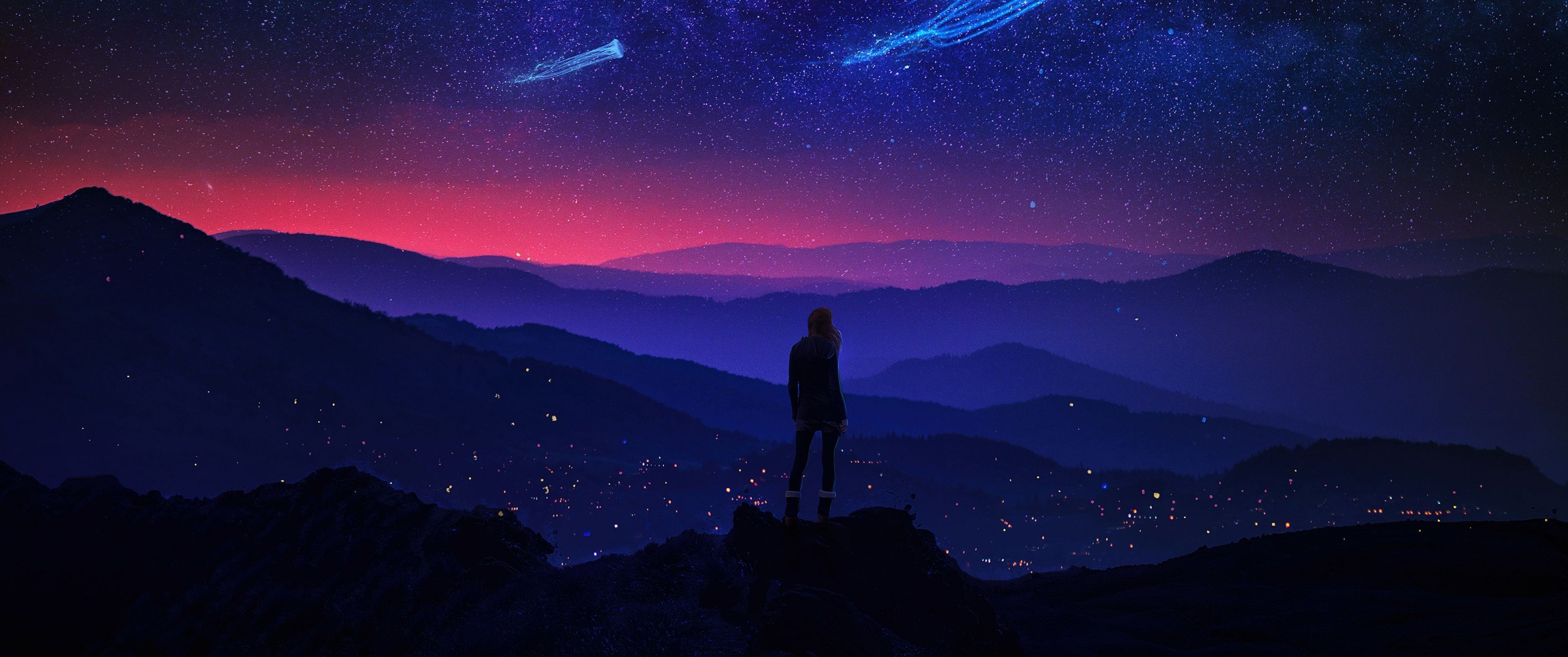 A person standing on a mountain looking at the night sky - 3440x1440