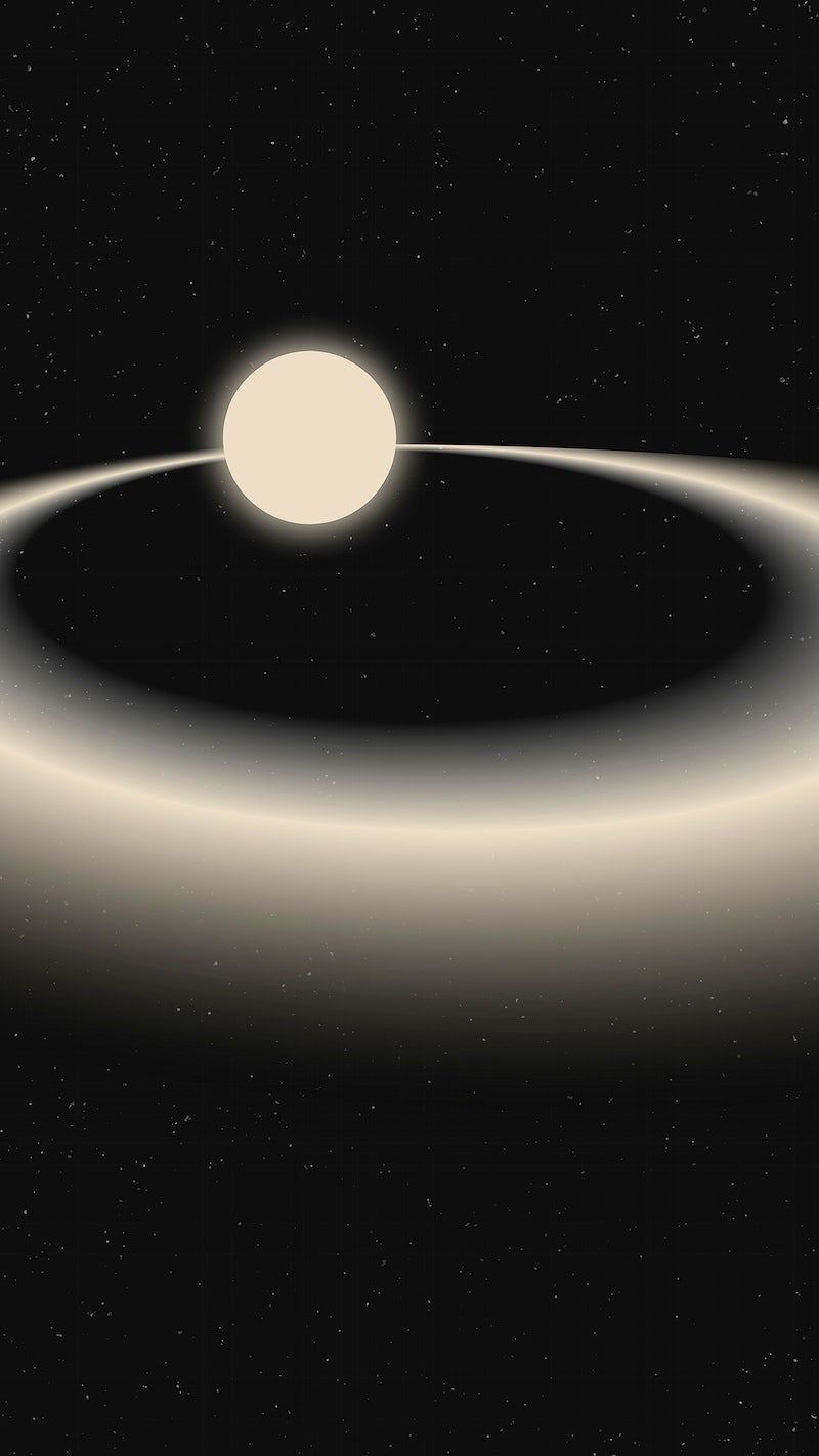 A planet with a ring system in front of a star - Saturn