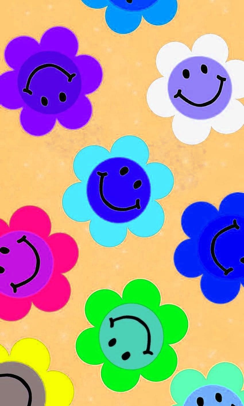 A picture of many different colored flowers with a smiley face in the middle of each flower. - Kidcore