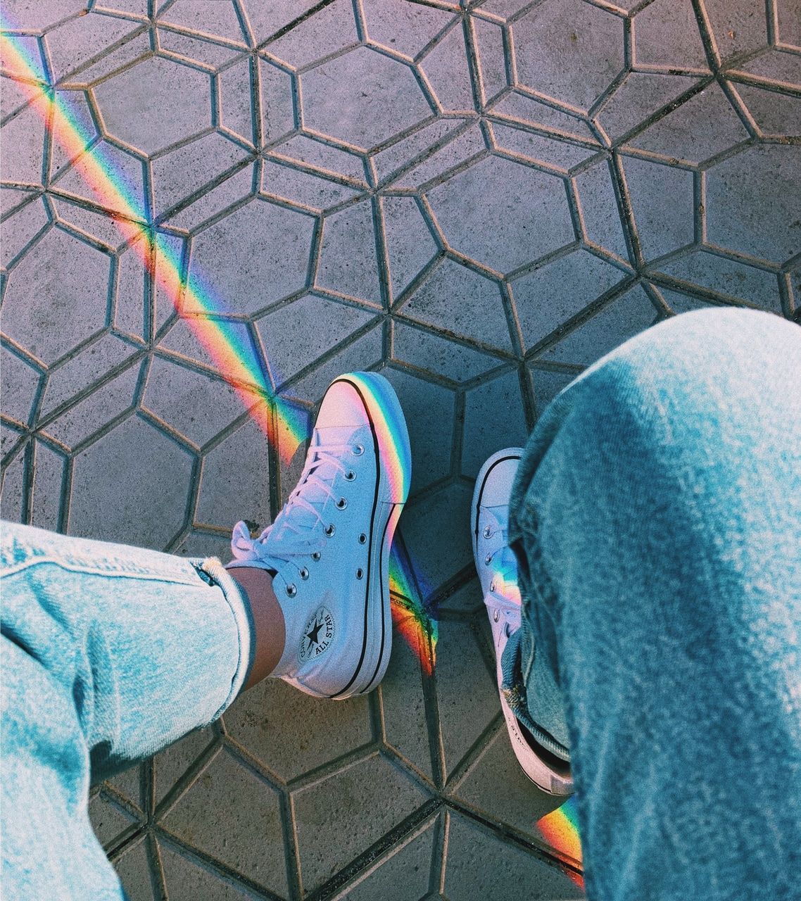 A person wearing white sneakers standing on tiles - Shoes, Converse