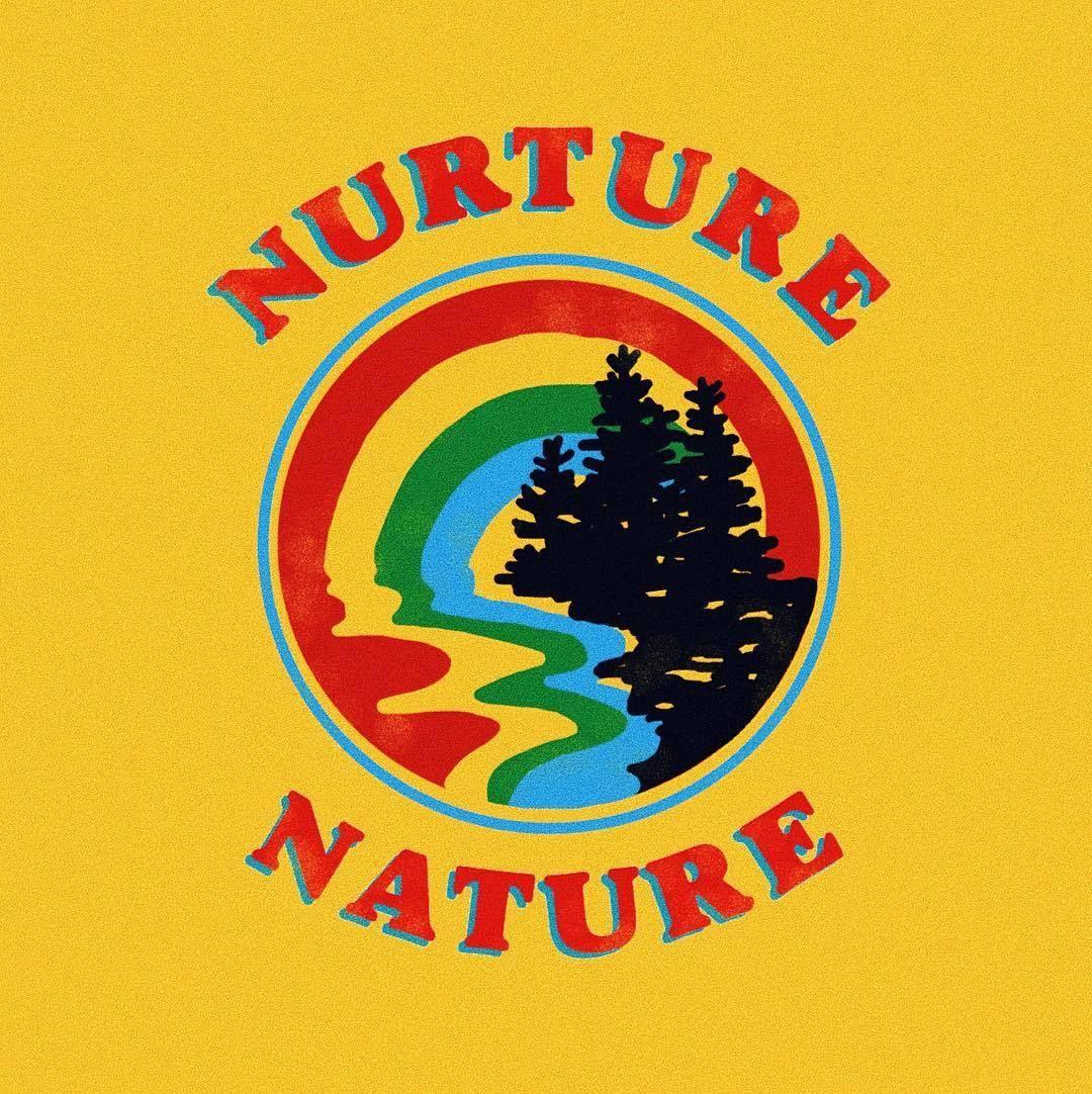 A yellow Nurture Nature t-shirt design with a rainbow and trees - Earth
