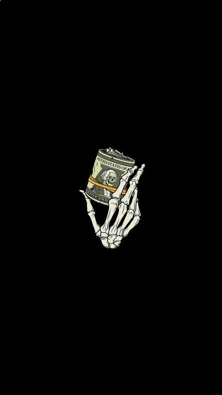 Skeleton hand holding a stack of money - Money