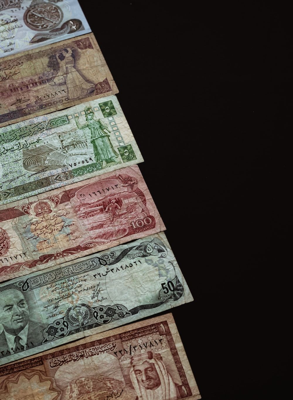 A row of money from different countries - Money