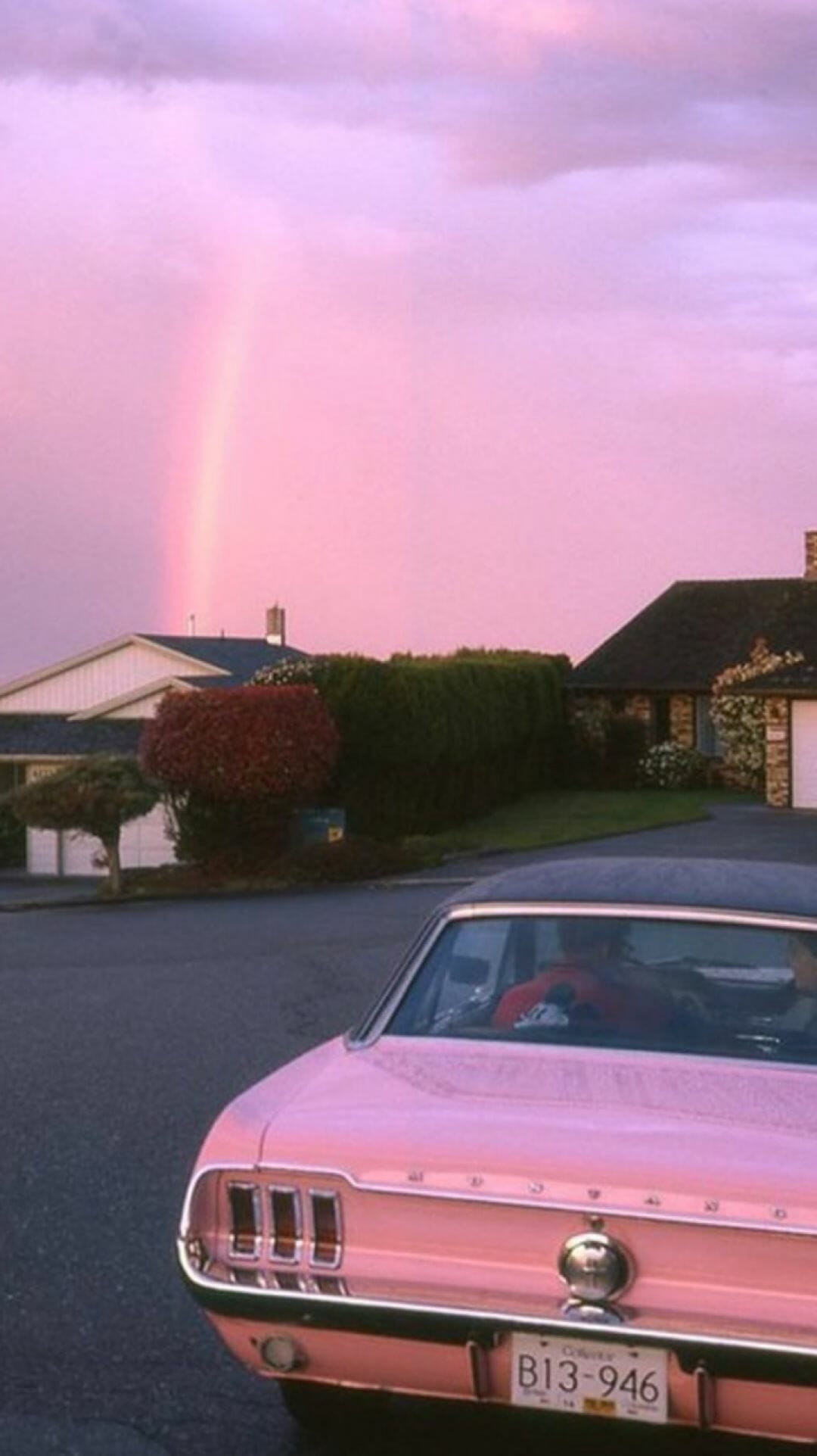 A pink car in front of a rainbow - Vintage, retro