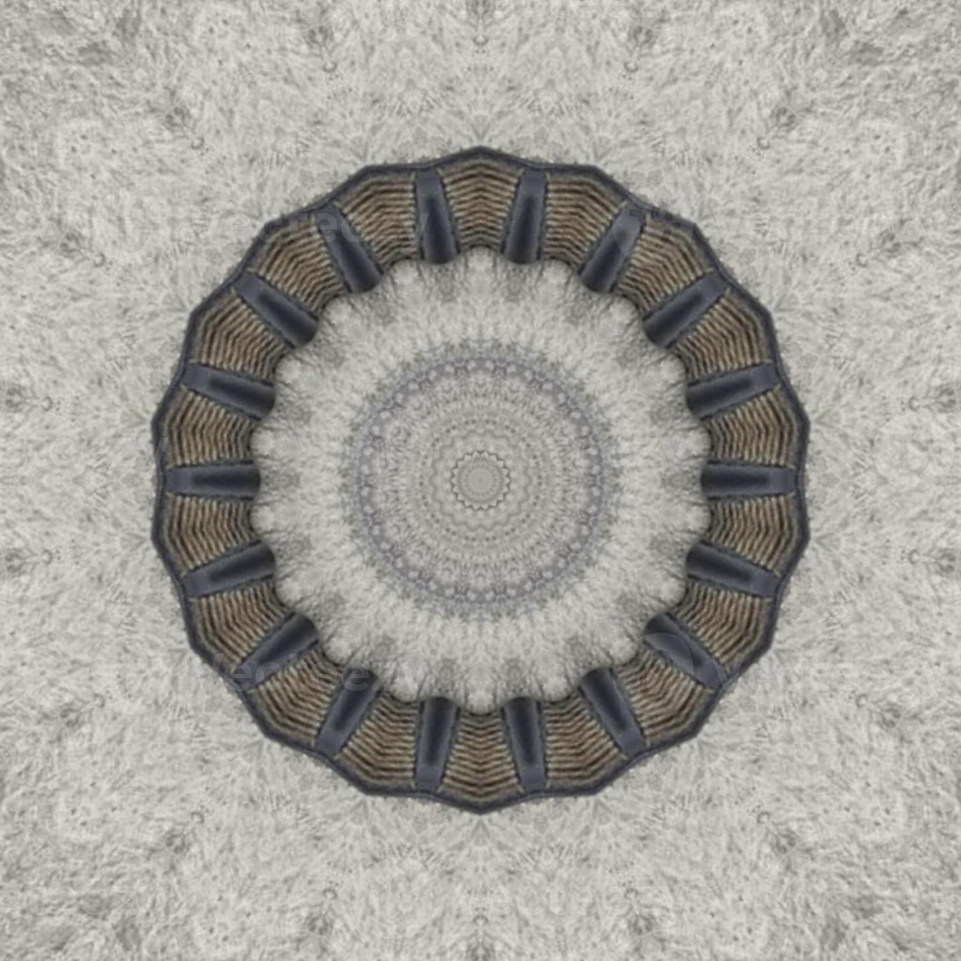 A circular pattern of black and brown colors against a light grey background. - Silver