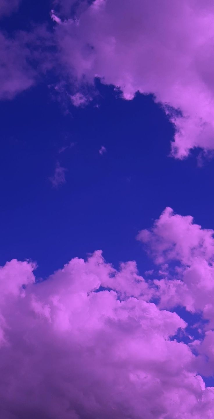 A purple sky with clouds and blue in the background - Beautiful