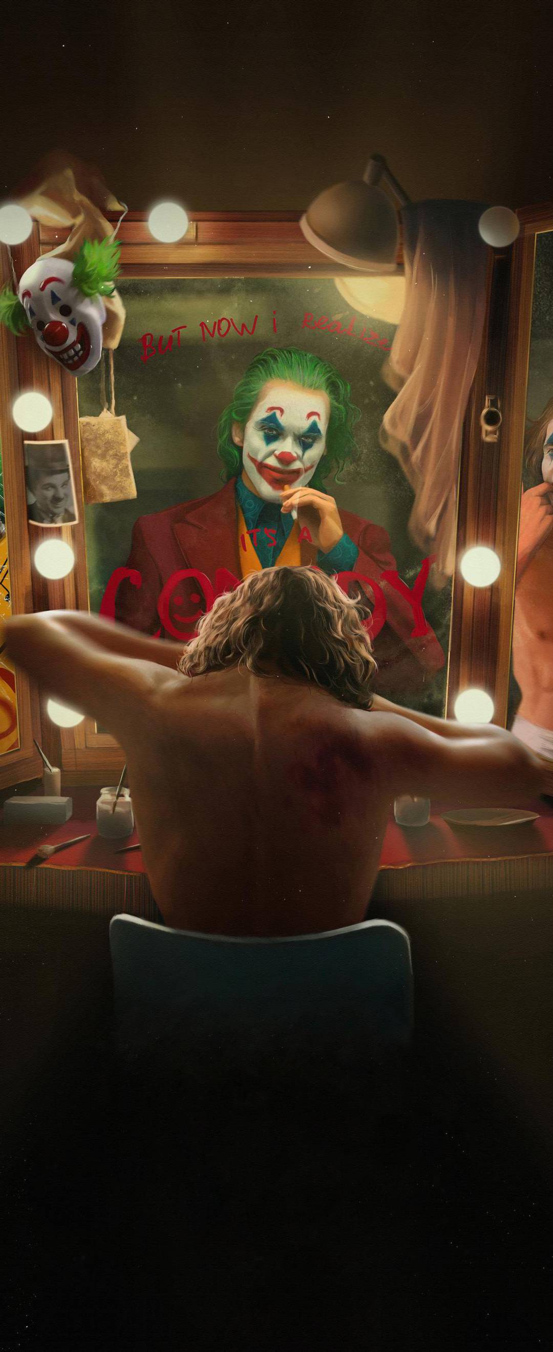 A man sitting in front of the mirror with joker makeup - Clown