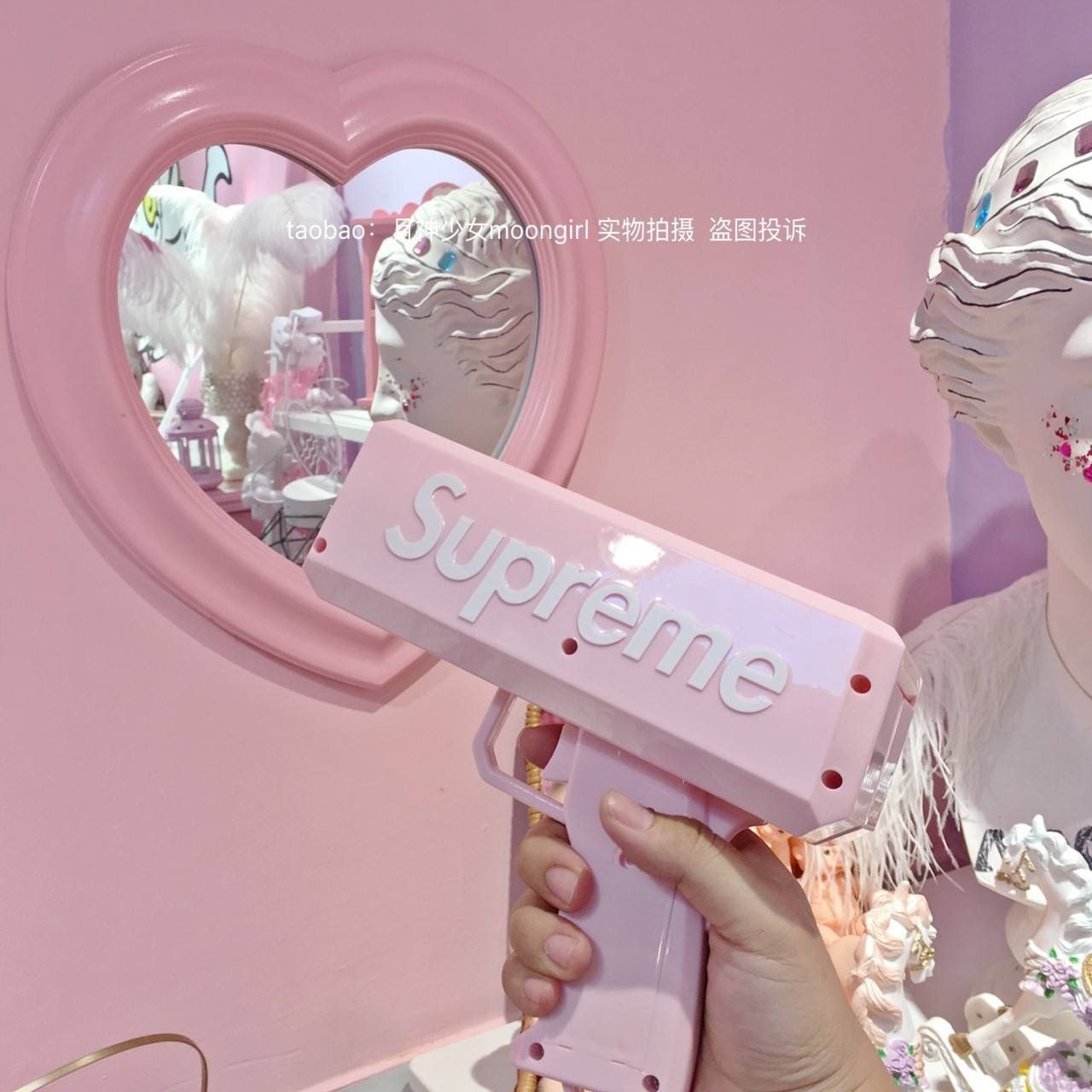 A pink mirror with a heart-shaped pink frame - Supreme