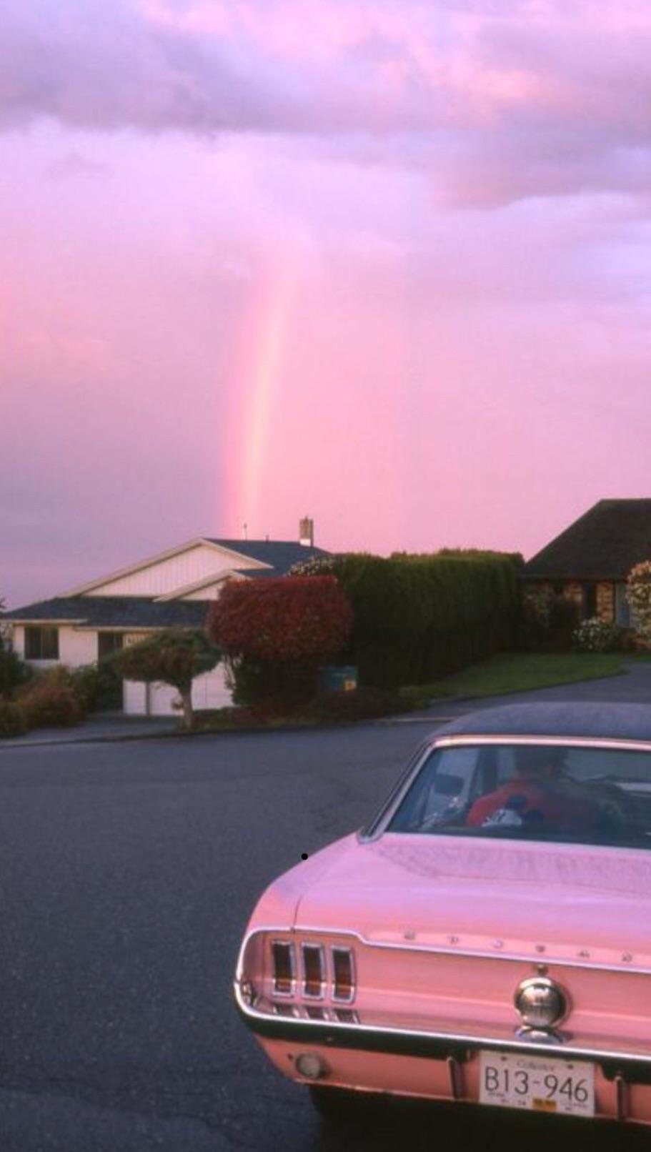 A pink car parked in front of houses - Pink, 90s, cars