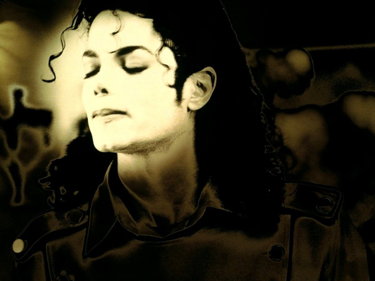 Michael Jackson is looking down at the ground. - Michael Jackson