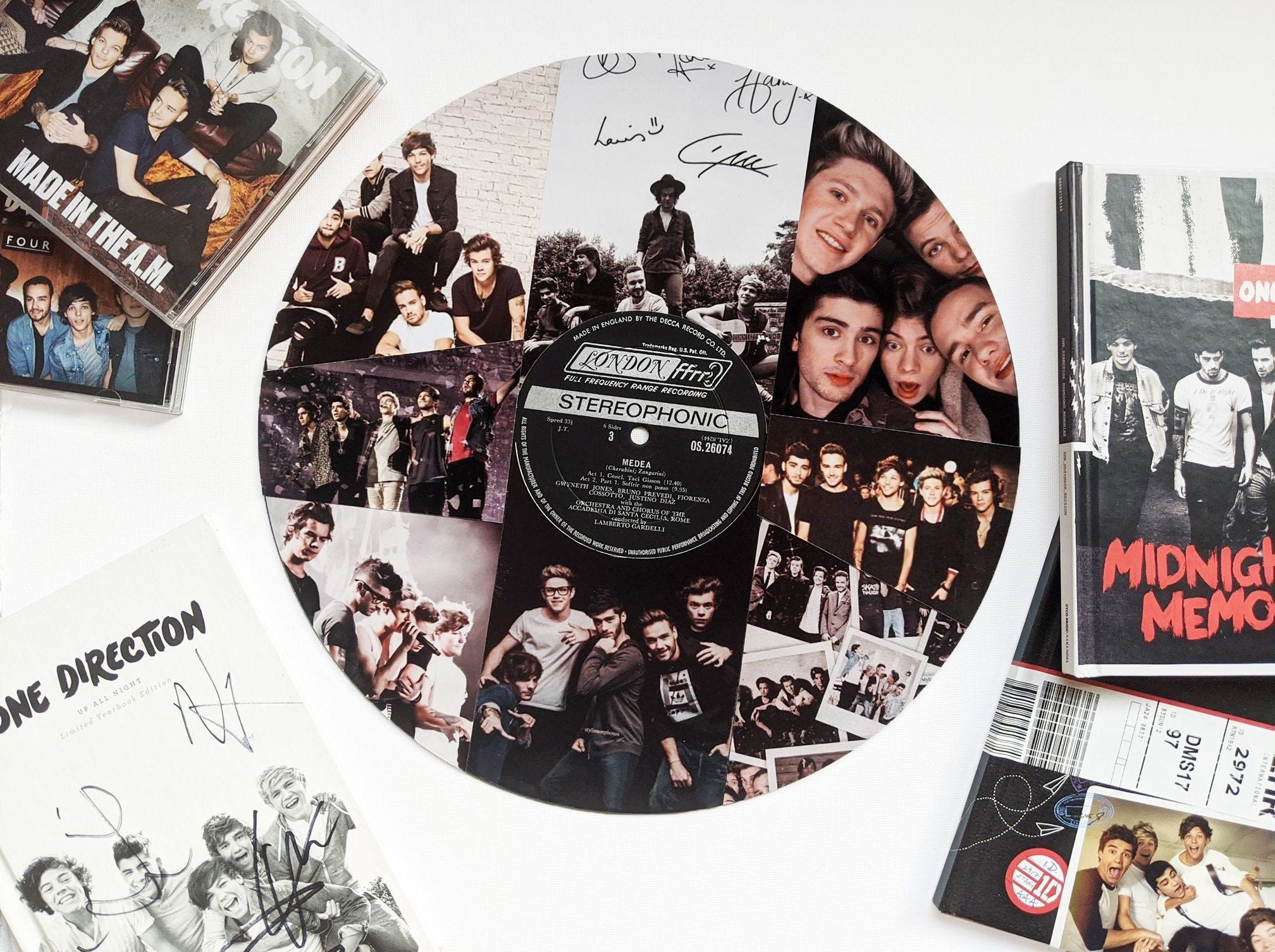 A collage of One Direction images on a vinyl record - One Direction