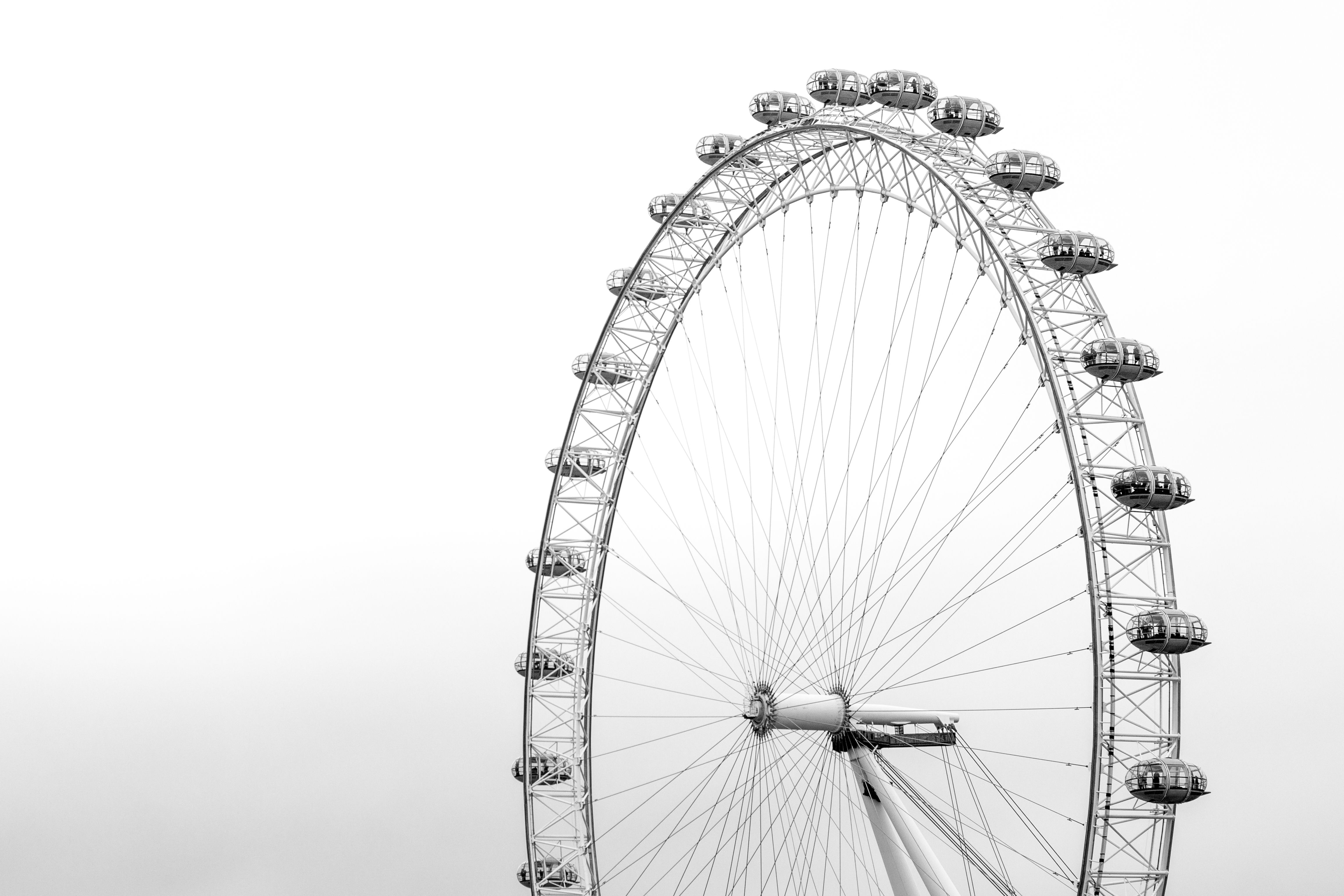 A black and white photo of the London Eye - London