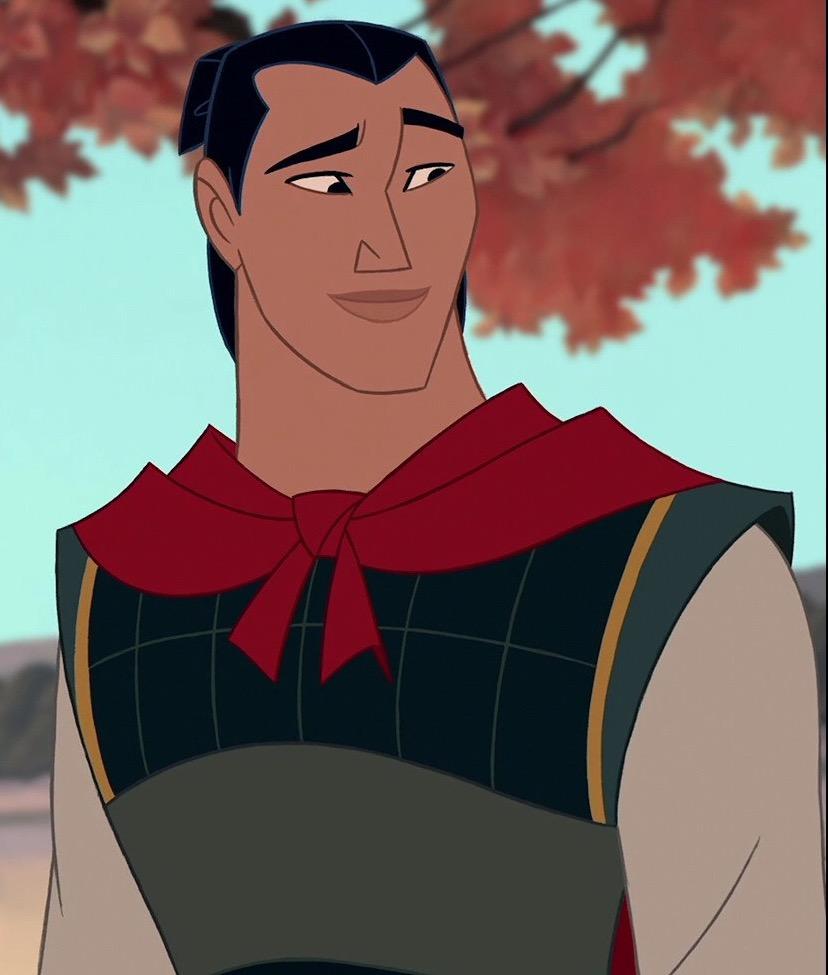 A man in an asian costume is looking at the camera - Mulan