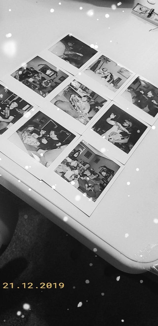 Black and white polaroid pictures on a table - Polaroid