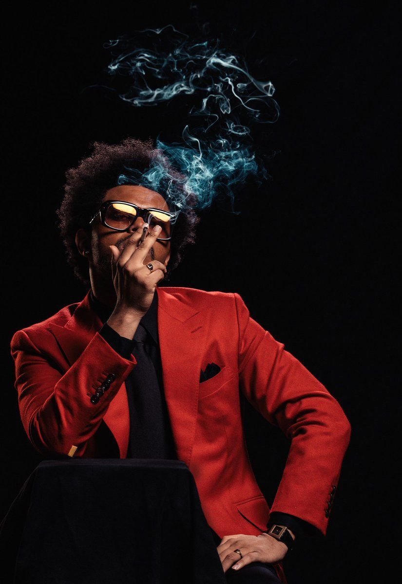The Weeknd wearing a red blazer and a black shirt - The Weeknd