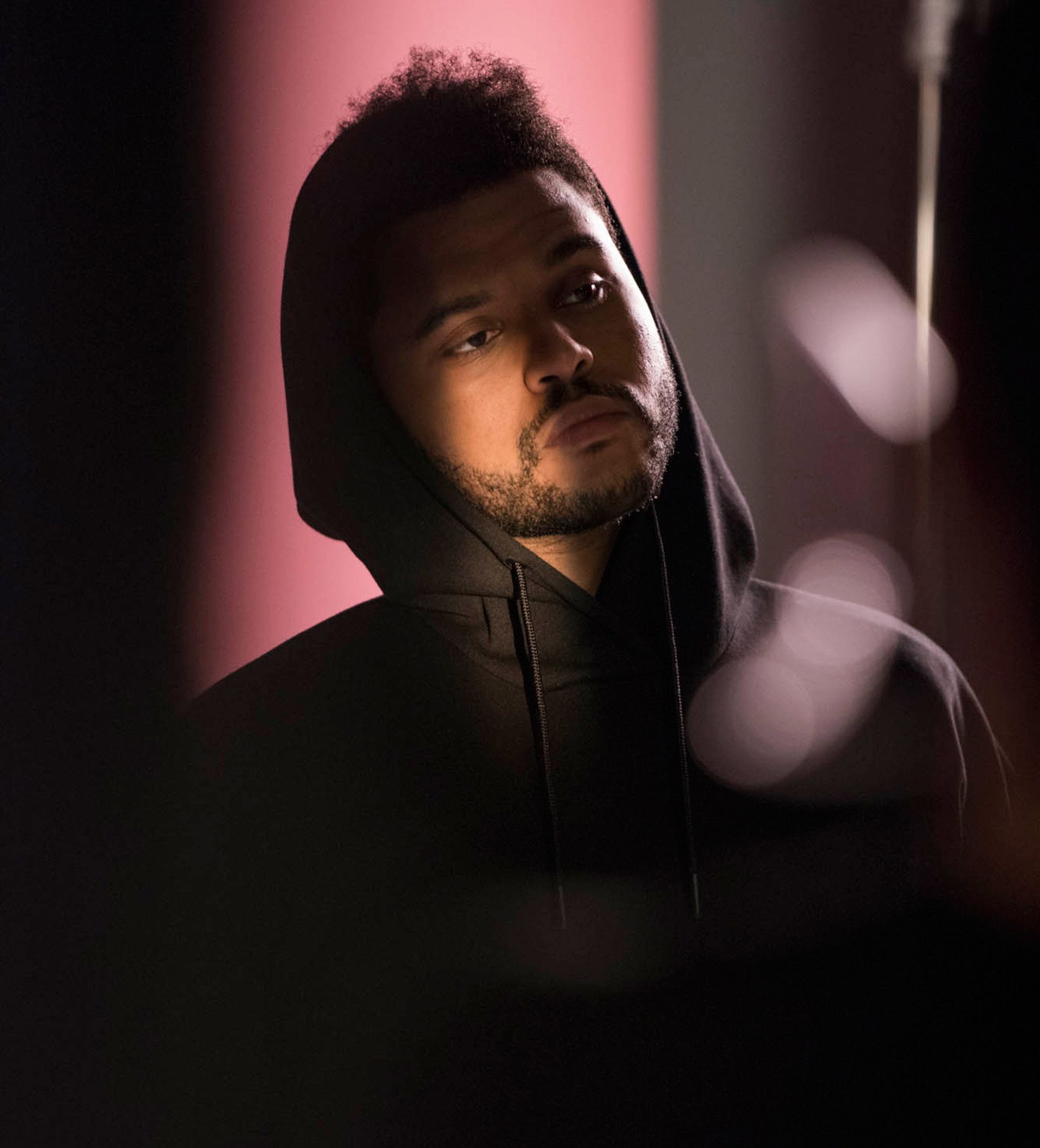 A man in black hoodie and beard - The Weeknd