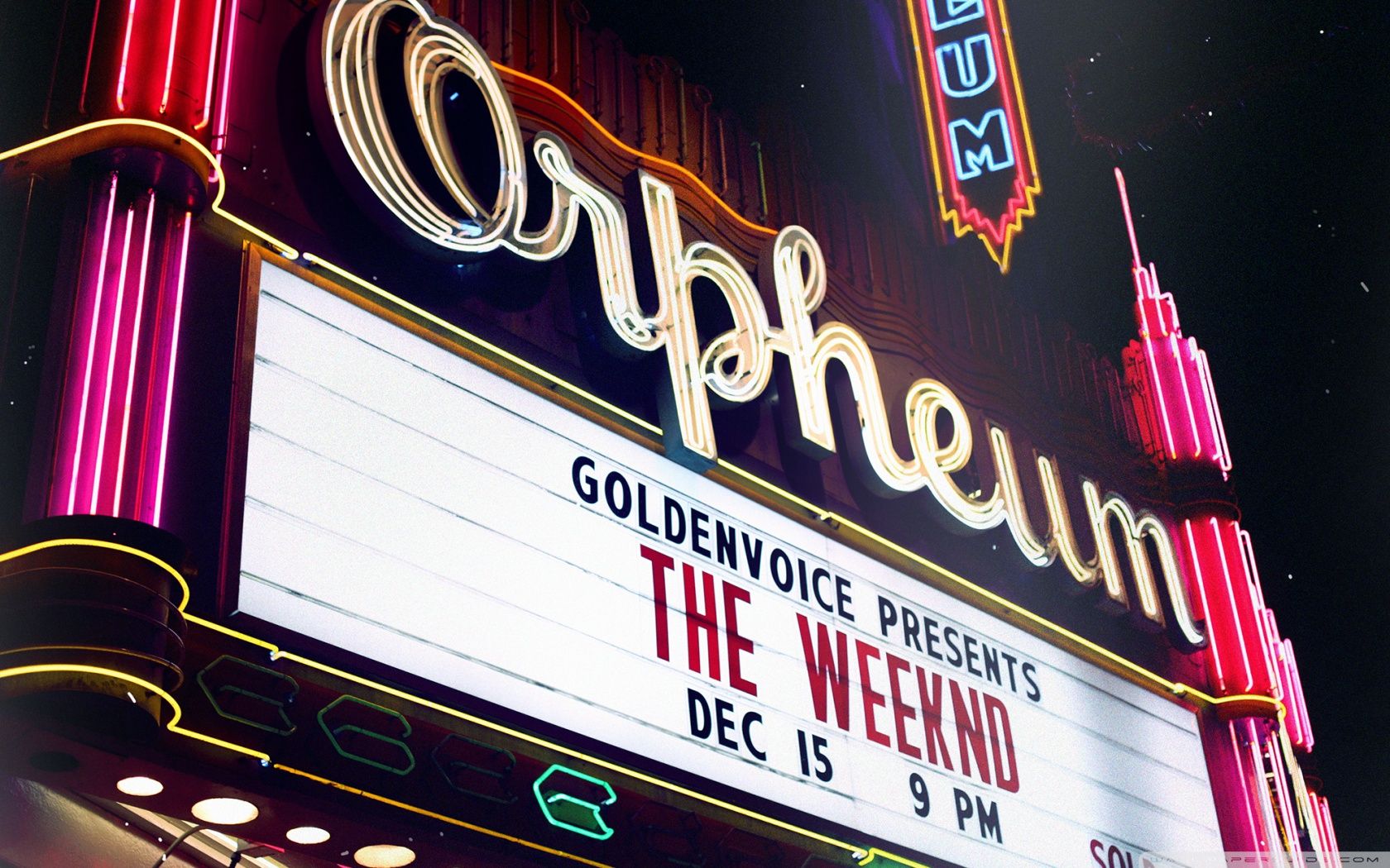 A neon sign for the wicked at an outdoor movie theatre - The Weeknd