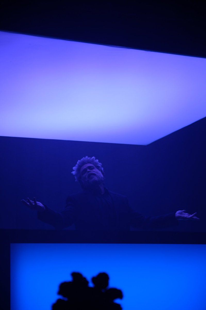 A man standing in front of an illuminated panel - The Weeknd