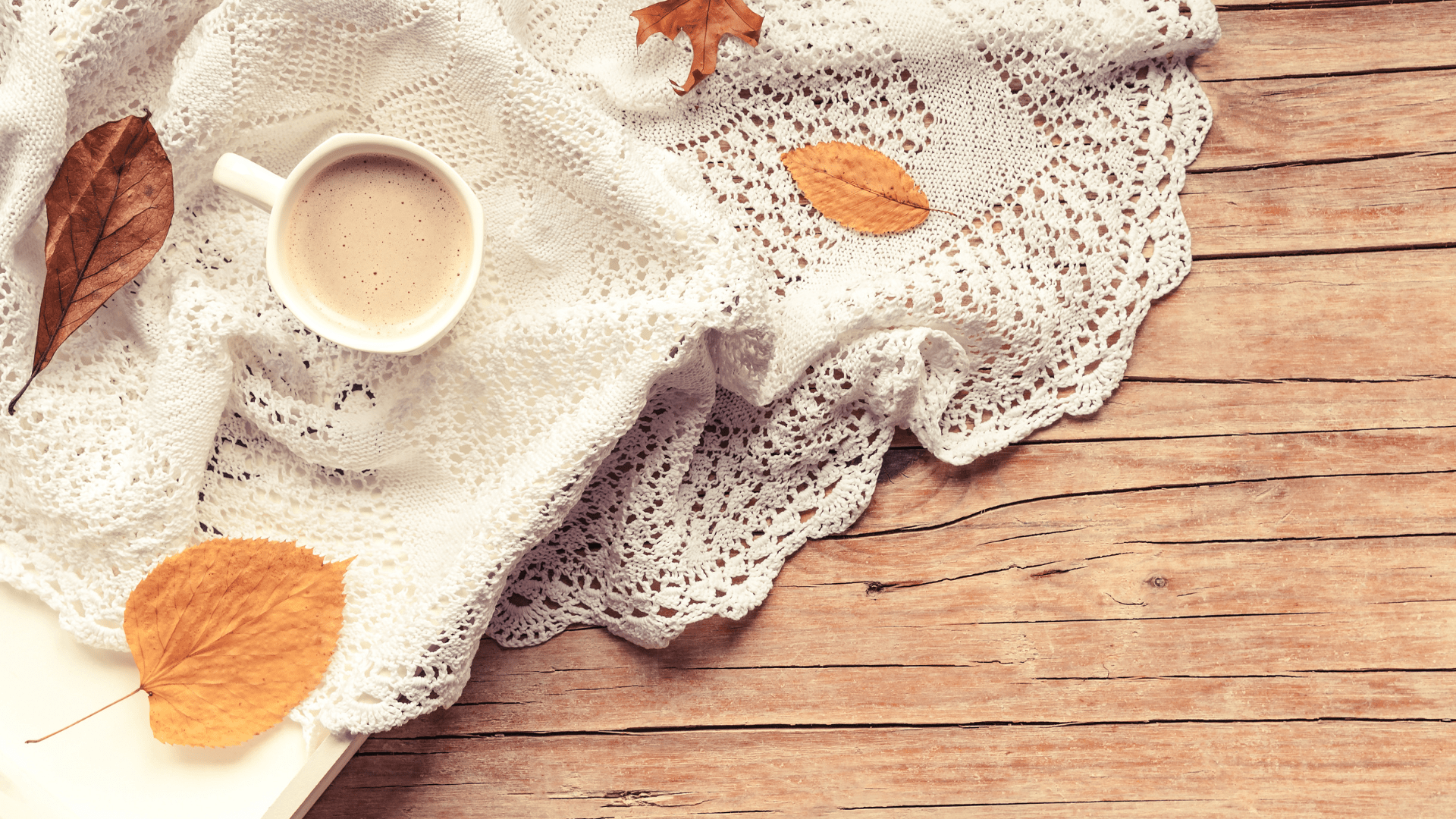 A cup of coffee and some leaves on top - Cozy