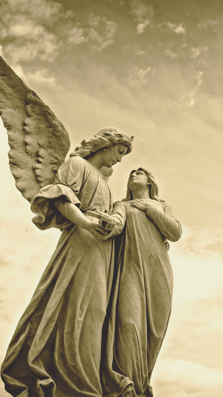 A statue of two angels holding hands - Angels