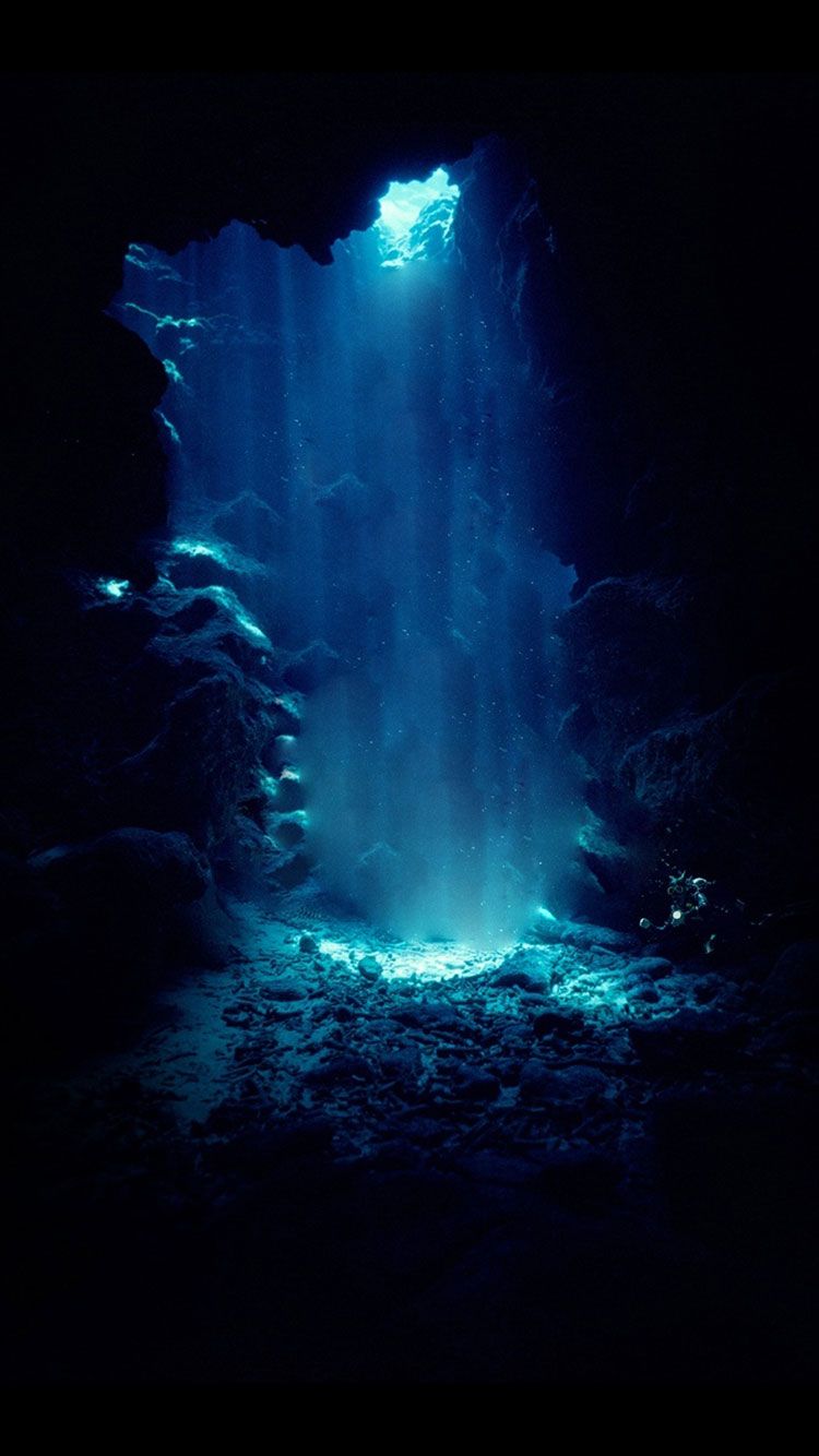 A cave with water flowing through it - Dark blue, navy blue