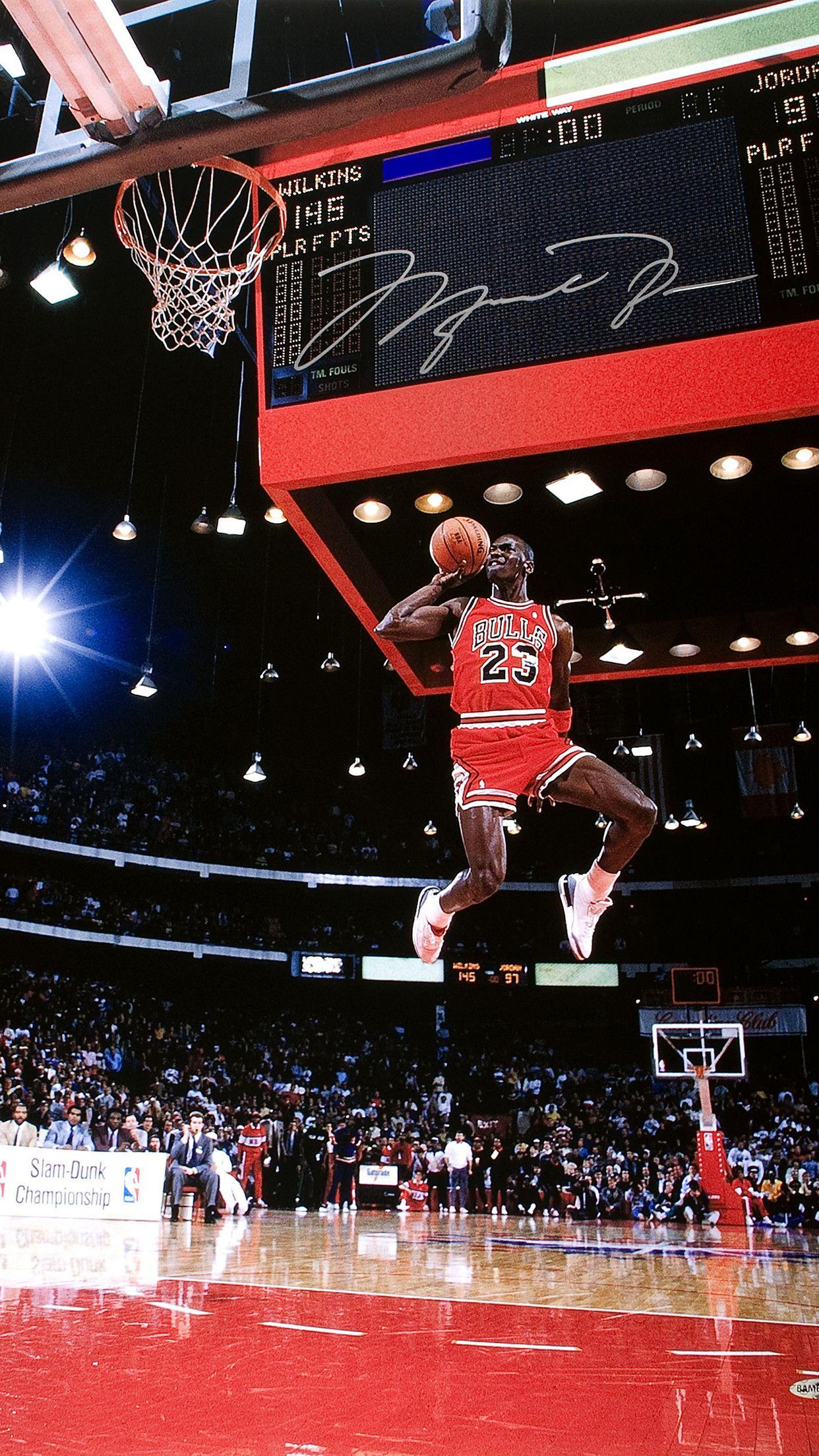 Michael Jordan in the middle of a dunk. - NBA