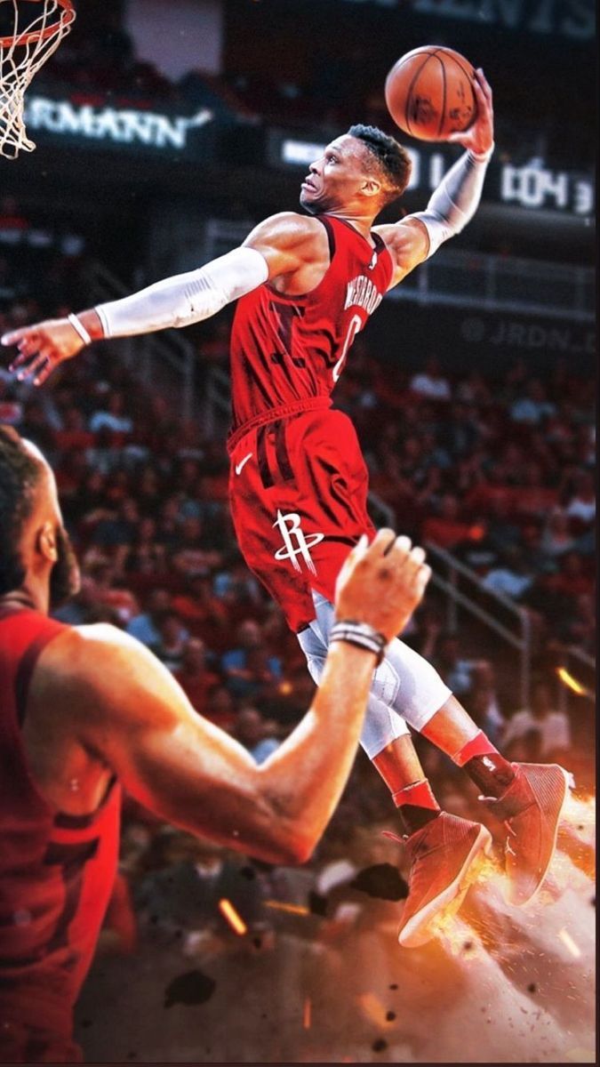 A basketball player in the air with his arms up - NBA