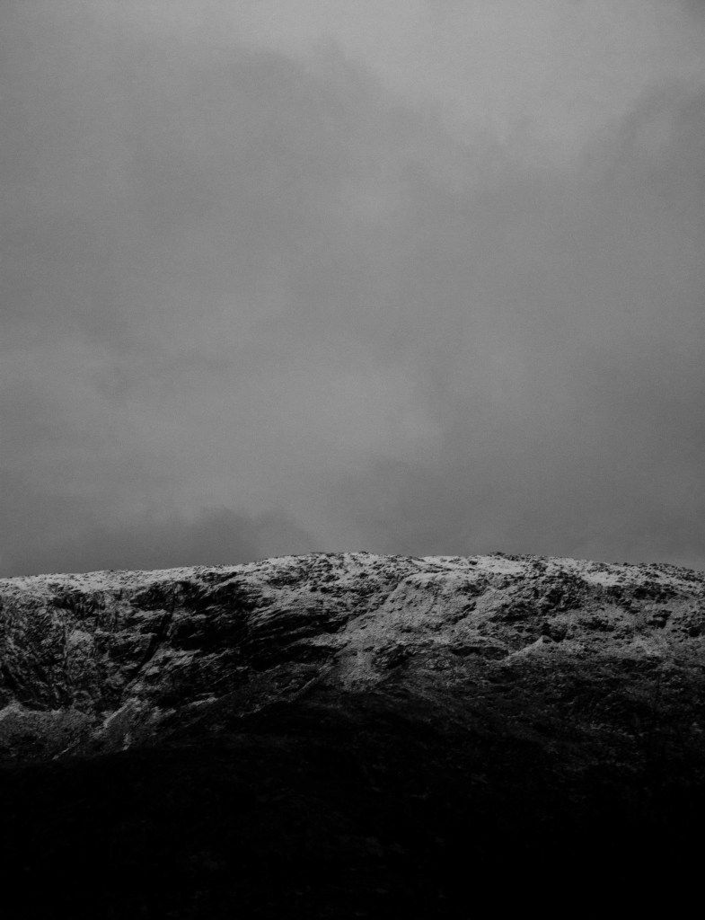 A black and white photo of snow on top - Gray, photography