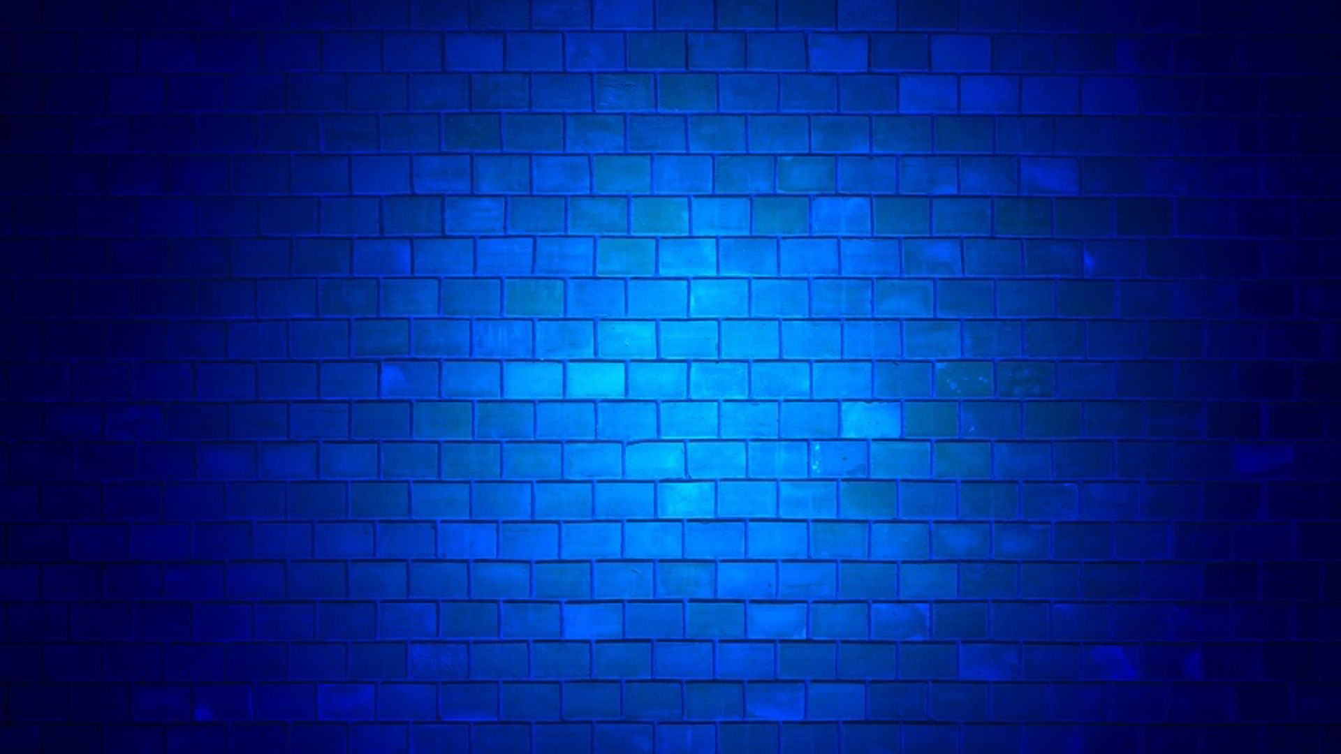 A blue brick wall with bright light - Dark blue, navy blue