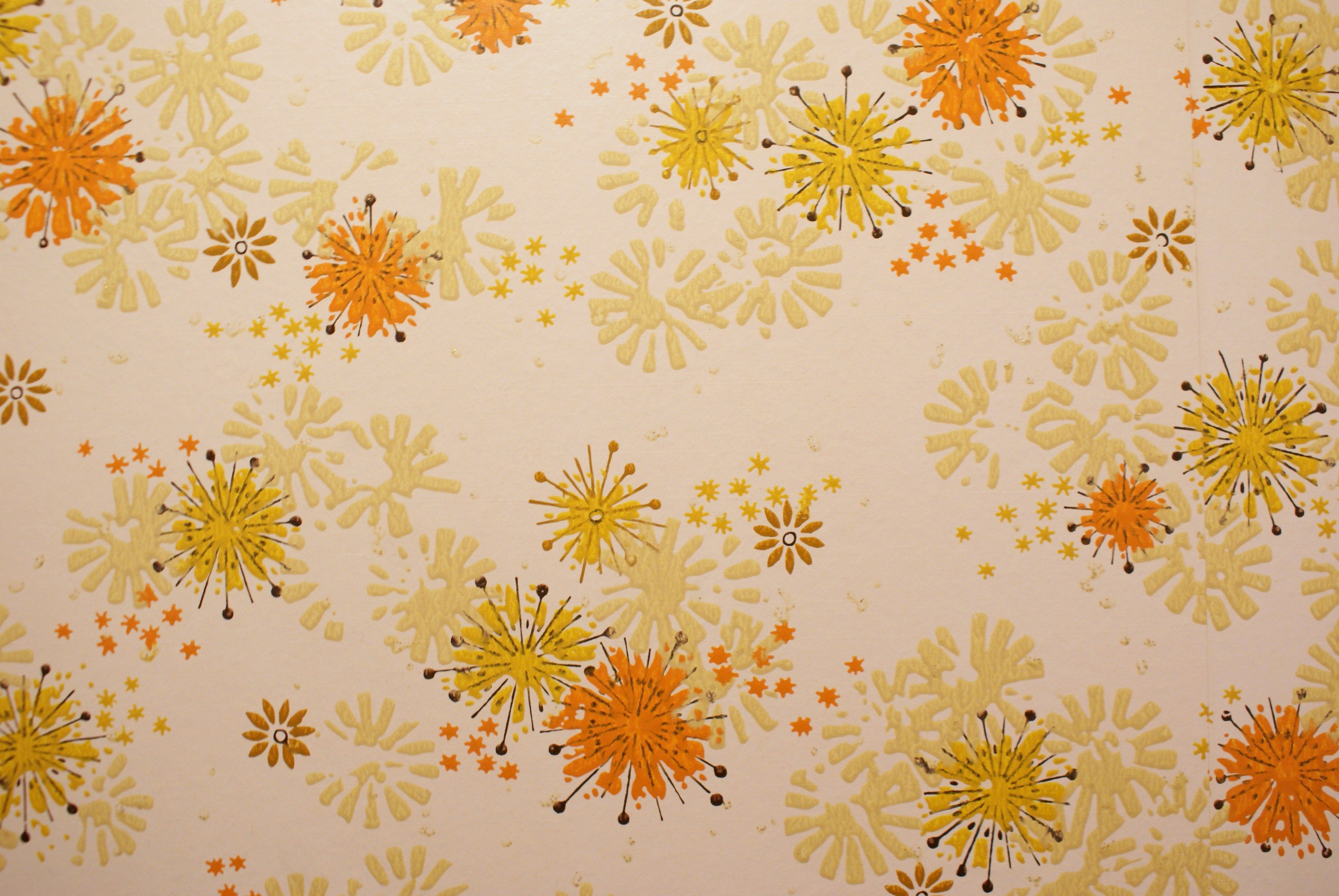 A vintage wallpaper with a pattern of orange and yellow flowers - 70s