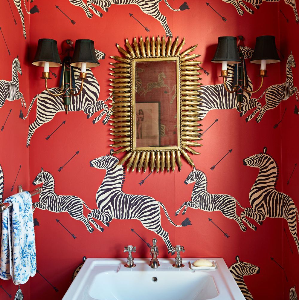A bathroom with red walls and zebra print - 60s