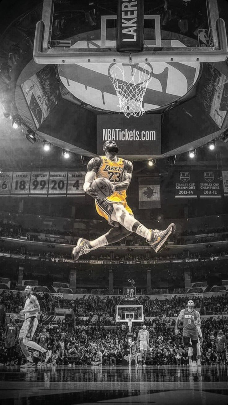A basketball player jumping over the rim - NBA, Lebron James