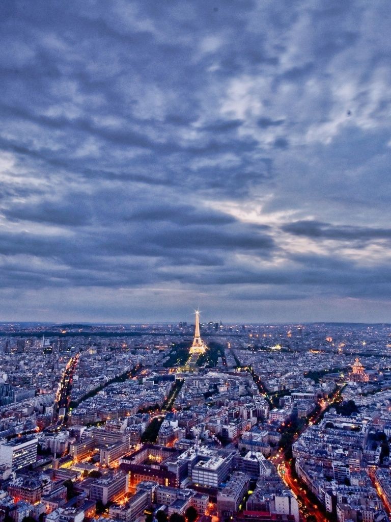 A cloudy sky over Paris with the Eiffel Tower in the background - Paris
